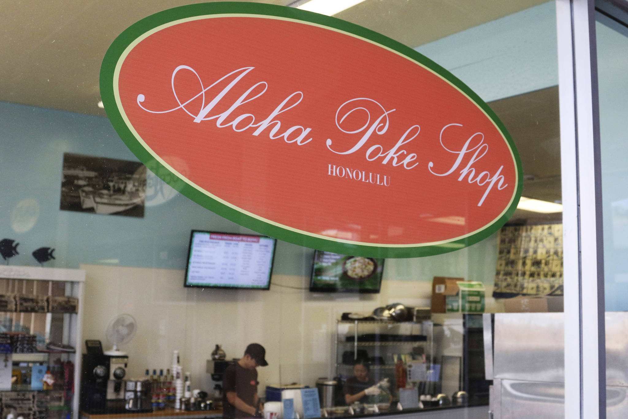 This April 16, 2019 photo shows Aloha Poke Shop, a store in Honolulu that received a letter from Chicago-based Aloha Poke Co. saying the Illinois company had trademarked “Aloha Poke” and the Hawaii company would need to change its name. Hawaii lawmakers are considering adopting a resolution calling for the creation of legal protections for Native Hawaiian cultural intellectual property. (Audrey McAvoy | Associated Press)