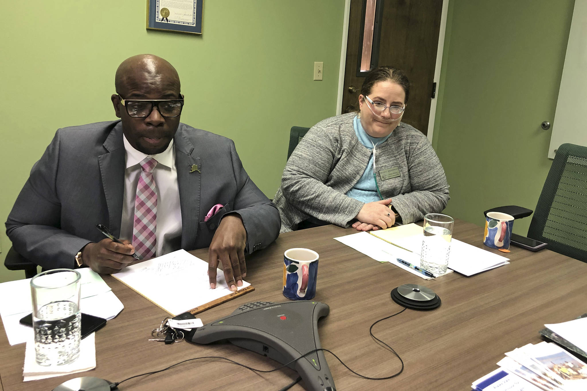 Marcus Sanders, left, and Megan Mackiernan are shown during a meeting of the Alaska State Commission for Human Rights on Thursday, April 18, 2019, in Anchorage, Alaska. Mackiernan was elected chairman and Sanders was elected vice chair after recent departures left the commission without members in those positions. (Mark Thiessen | Associated Press)