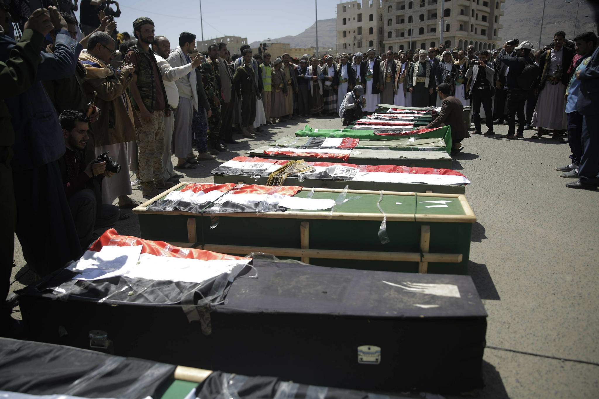 In this April 10, 2019 photo, mourners attend a mass funeral of victims of an explosion on April 7 during a funeral procession in Sanaa, Yemen. Residents of the Yemeni capital recounted the horror of a large explosion that killed more than a dozen civilians, including seven children and wounded more than 100. (Hani Mohammed | Associated Press File)