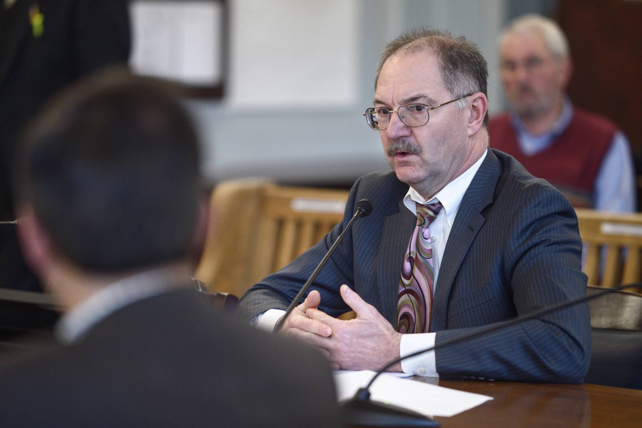 David Teal, Director of the Legislative Finance Division, gives his analysis of Gov. Mike Dunleavy’s state budget to the Senate Finance Committee at the Capitol on Tuesday, Feb. 26, 2019. (Michael Penn | Juneau Empire File)