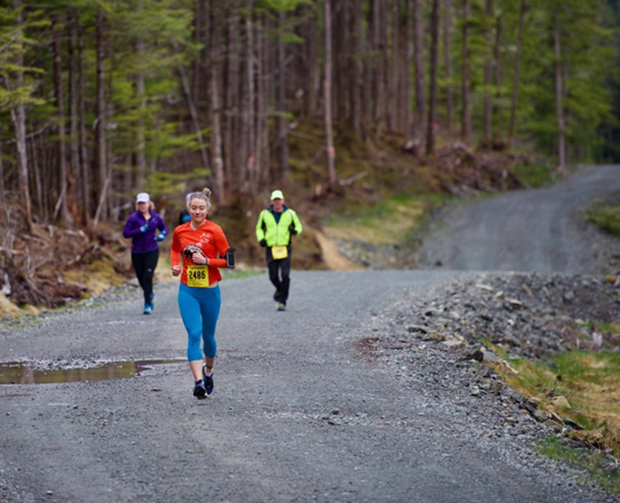Runners race in the Run 4 the Rock race on Pioneer Road and North Douglas Highway on Saturday. (Courtesy photo | Matthew York)