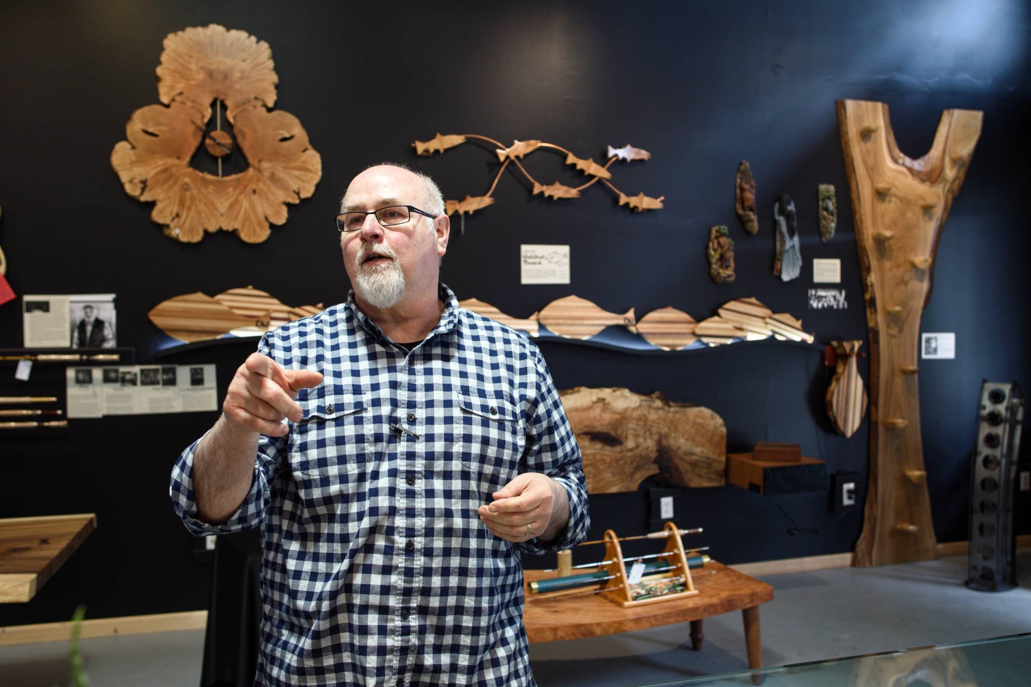 Dean Graber, owner of Rainforest Custom, talks Thursday, April 25, 2019, about his new shop on South Franklin Street that will display his and 14 other local artisans’ handicrafts. (Michael Penn | Juneau Empire)