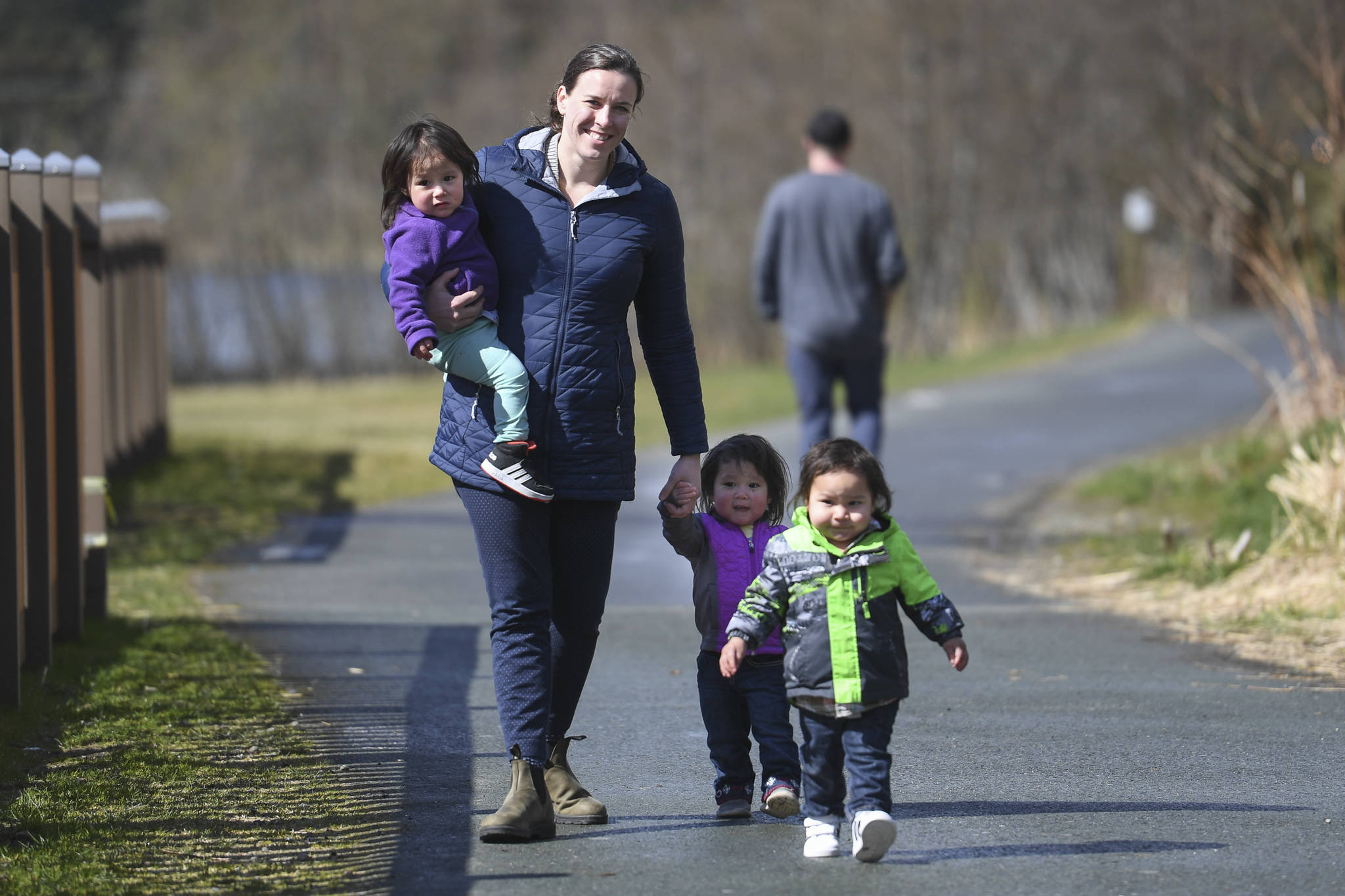 Shannon Fisher, executive director of Family Promise of Juneau, watches over the children of Steve and Mary Littlefield, Angeline, Maximus and Tiana, as the parents are interviewed about the program at Twin Lakes on Wednesday, April 24, 2019. (Michael Penn | Juneau Empire)