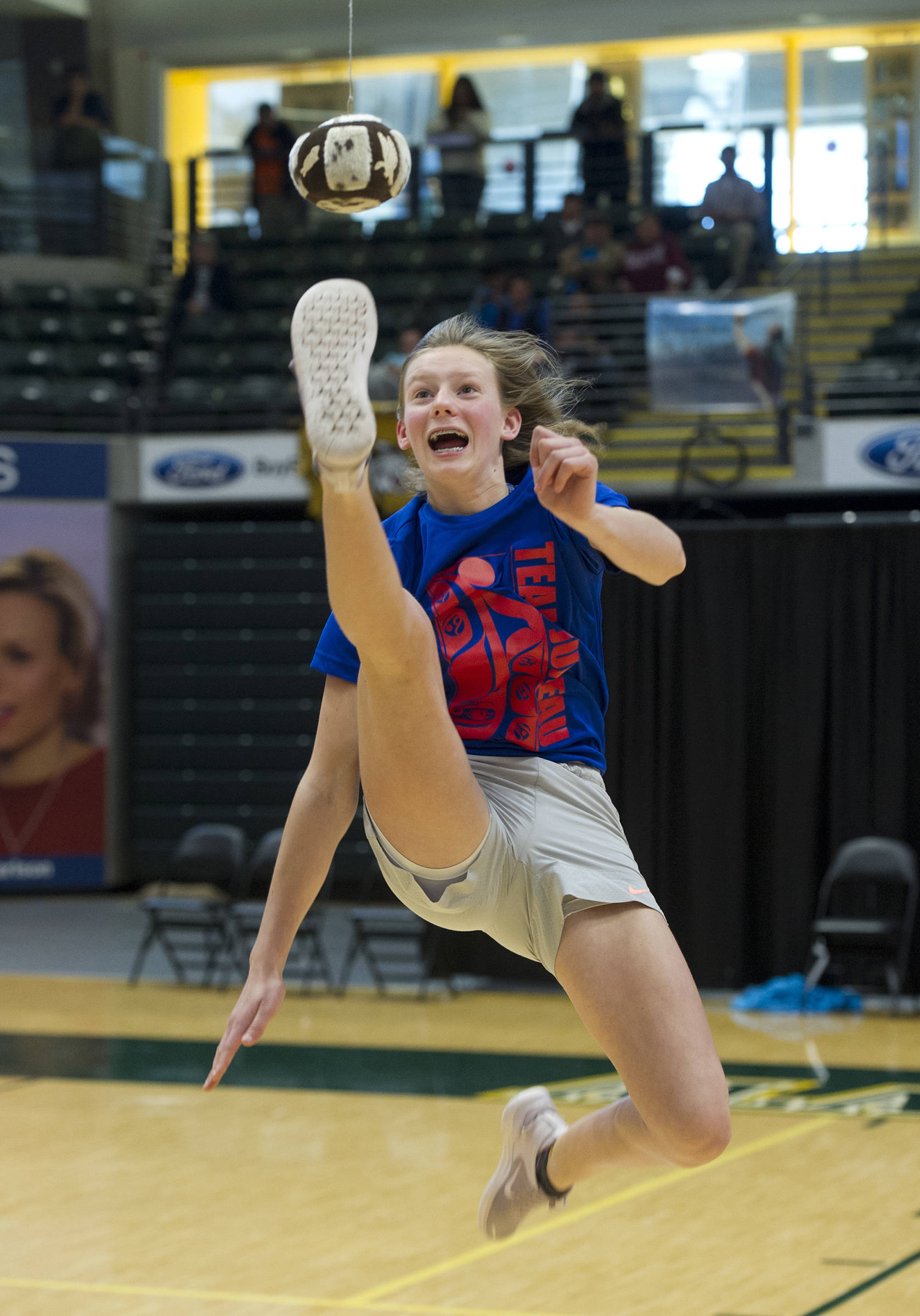 Skylar Tuckwood performs the one-foot high kick at the 2019 NYO Games at the Alaska Airlines Center in Anchorage, Alaska, on Saturday, April 27, 2019. (Michael Dinneen | For the Juneau Empire)