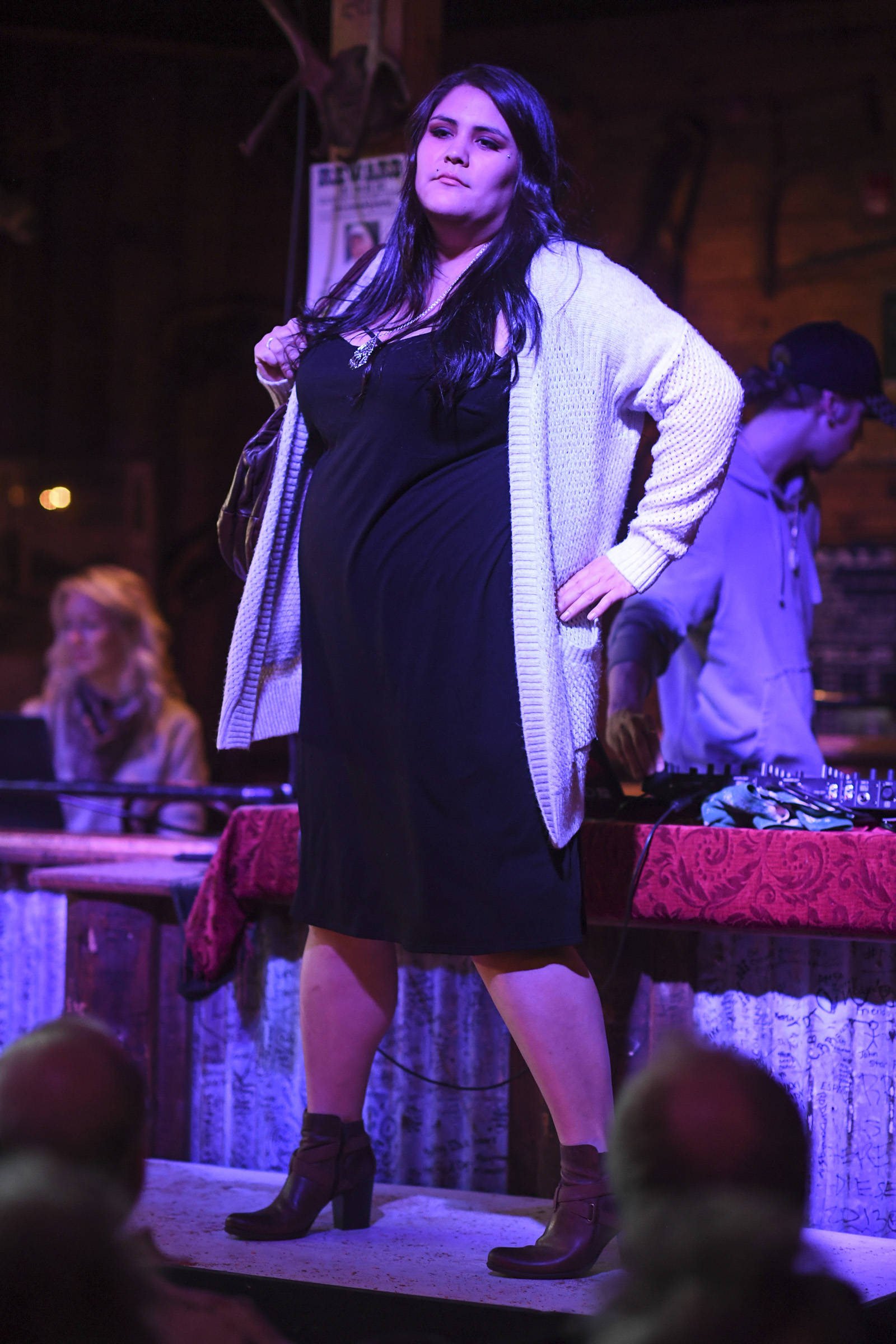 Women’s clothing from Alaskan Dames is modeled on stage during the Juneau Rotaract’s Wild West Roundup Fashion Show at the Red Dog Saloon on Saturday, April 27, 2019. (Michael Penn | Juneau Empire)