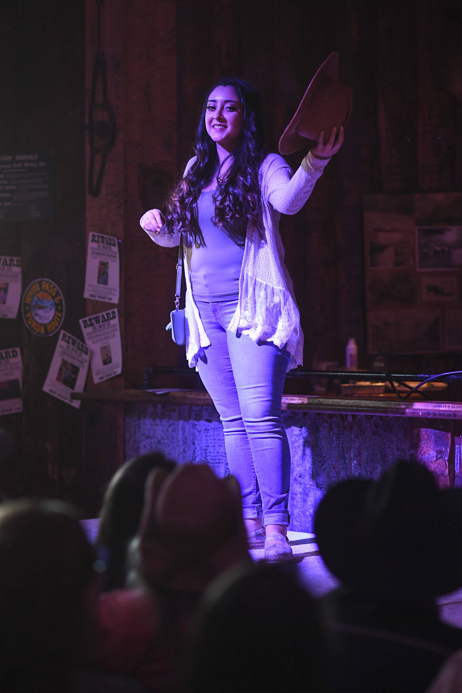 Women’s clothing from Alaskan Dames is modeled on stage during the Juneau Rotaract’s Wild West Roundup Fashion Show at the Red Dog Saloon on Saturday, April 27, 2019. (Michael Penn | Juneau Empire)