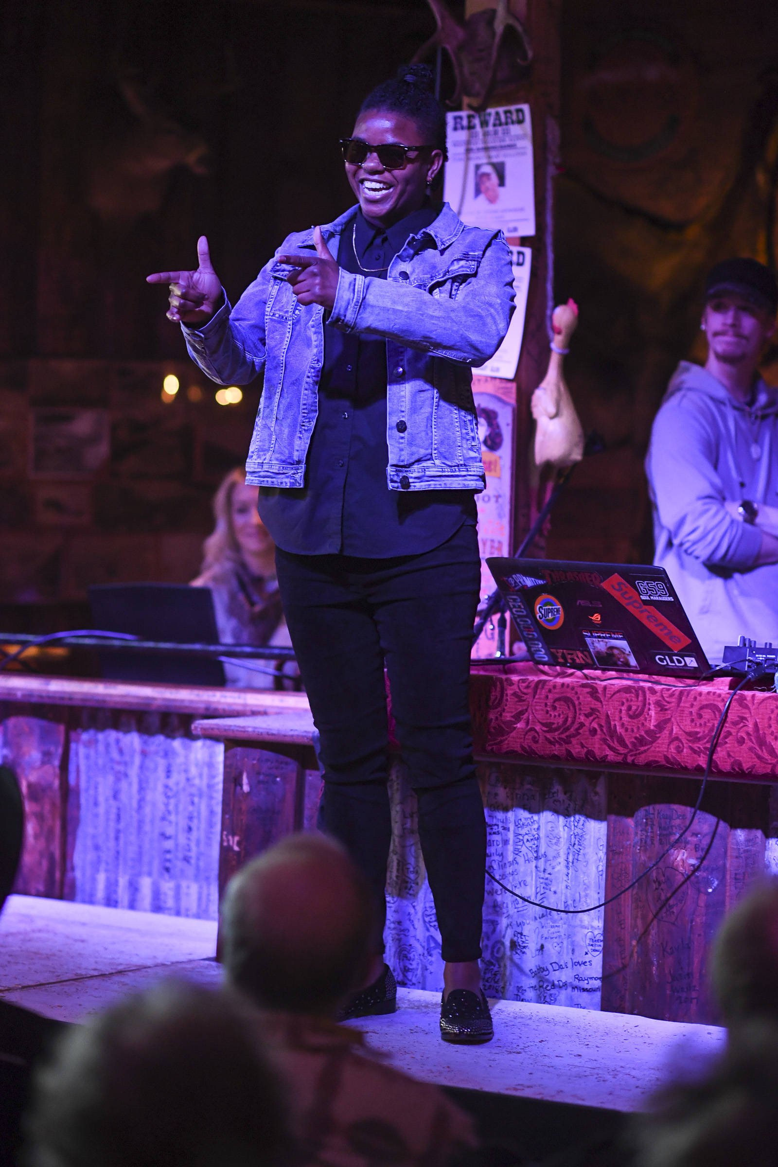 Women’s clothing and shoes from Shoefly is modeled on stage during the Juneau Rotaract’s Wild West Roundup Fashion Show at the Red Dog Saloon on Saturday, April 27, 2019. (Michael Penn | Juneau Empire)