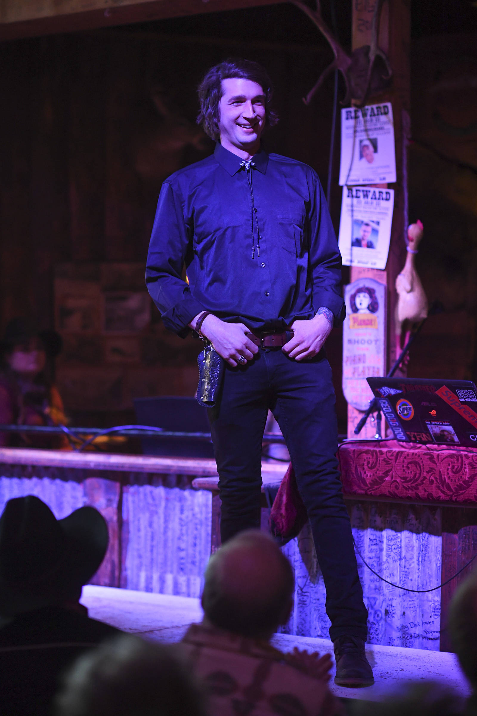 Men’s clothing from 4th Coast Outfitters is modeled on stage during the Juneau Rotaract’s Wild West Roundup Fashion Show at the Red Dog Saloon on Saturday, April 27, 2019. (Michael Penn | Juneau Empire)