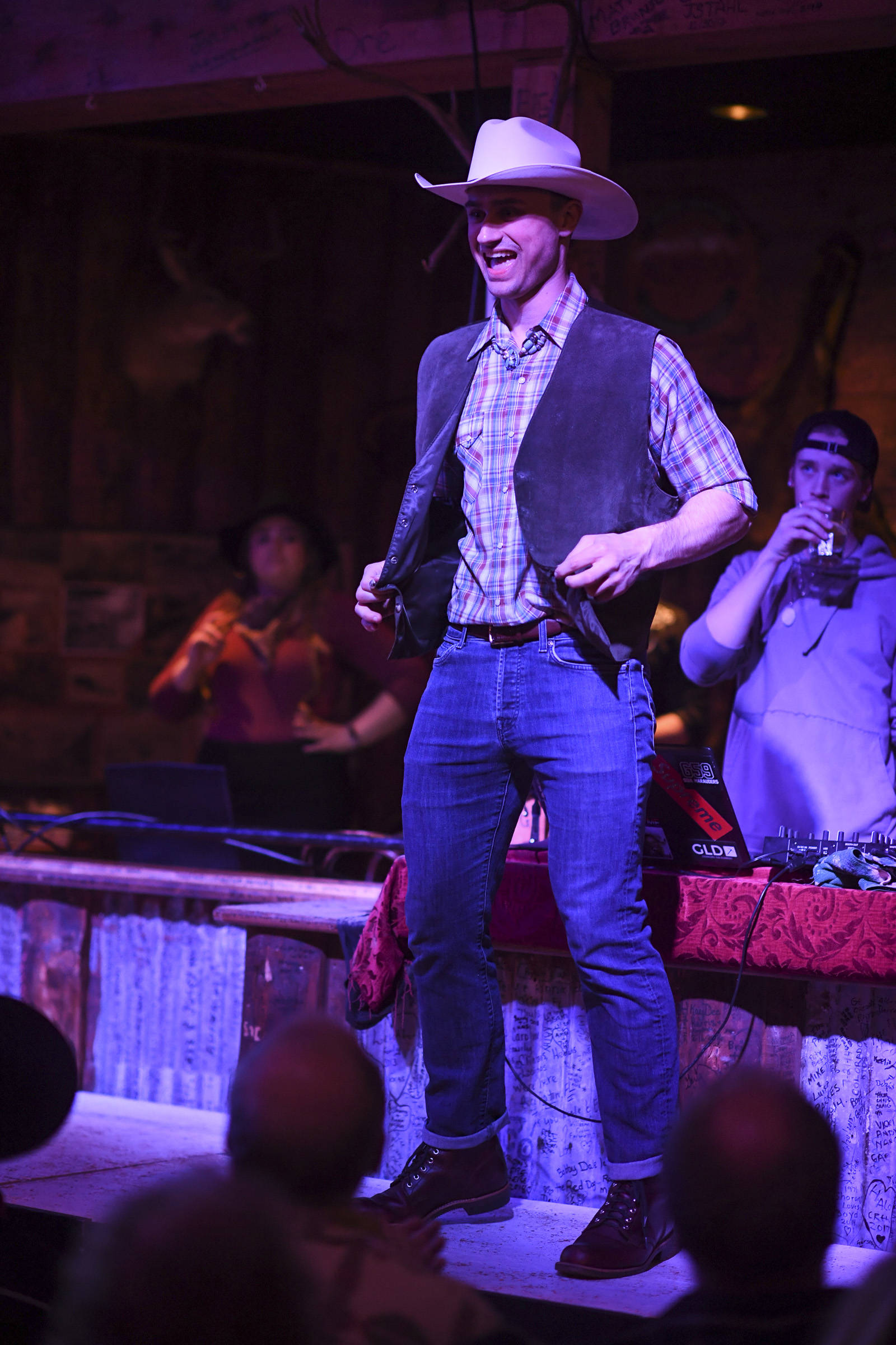 Men’s and women’s clothing from Downtown Dames Resale Shop is modeled on stage during the Juneau Rotaract’s Wild West Roundup Fashion Show at the Red Dog Saloon on Saturday, April 27, 2019. (Michael Penn | Juneau Empire)