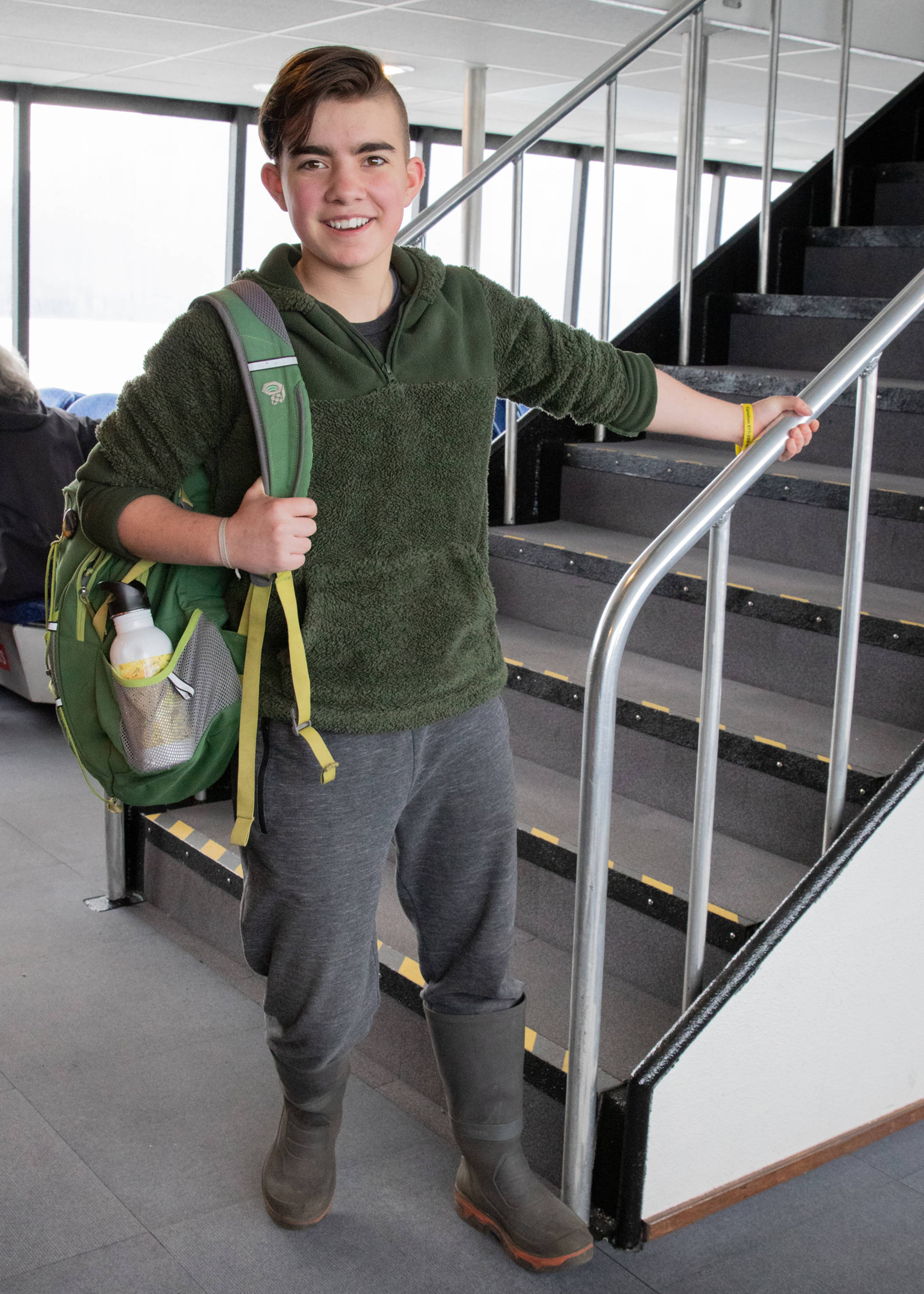 May 19, 2019: Seth Coppens, an eighth grader at the Juneau Montessori School, has artistic flair. On this day, aboard an Allen Marine boat, he wore simple and livable clothes: a forest green fleece pullover and gray sweat pants by Dip, mandatory Grundens boots and a Mountain Hardwear backpack. What also caught my eye was his great undercut hair style, which he created, and his genuine smile. Seth is also an accomplished playwright — his original play, “Sockeye,” was performed in Juneau earlier in May.