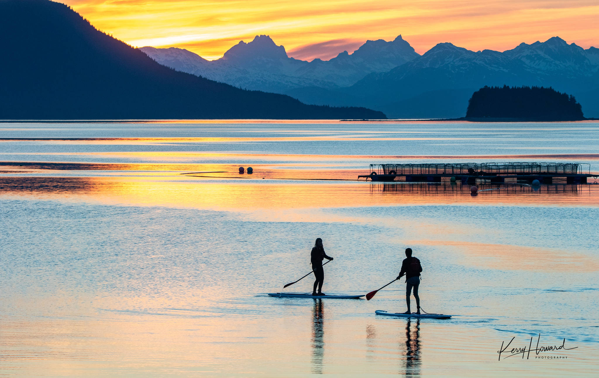 Paddleboarders enjoy a beautiful sunset from Lena Cove on May 22, 2019. (Courtesy Photo | Kerry Howard)