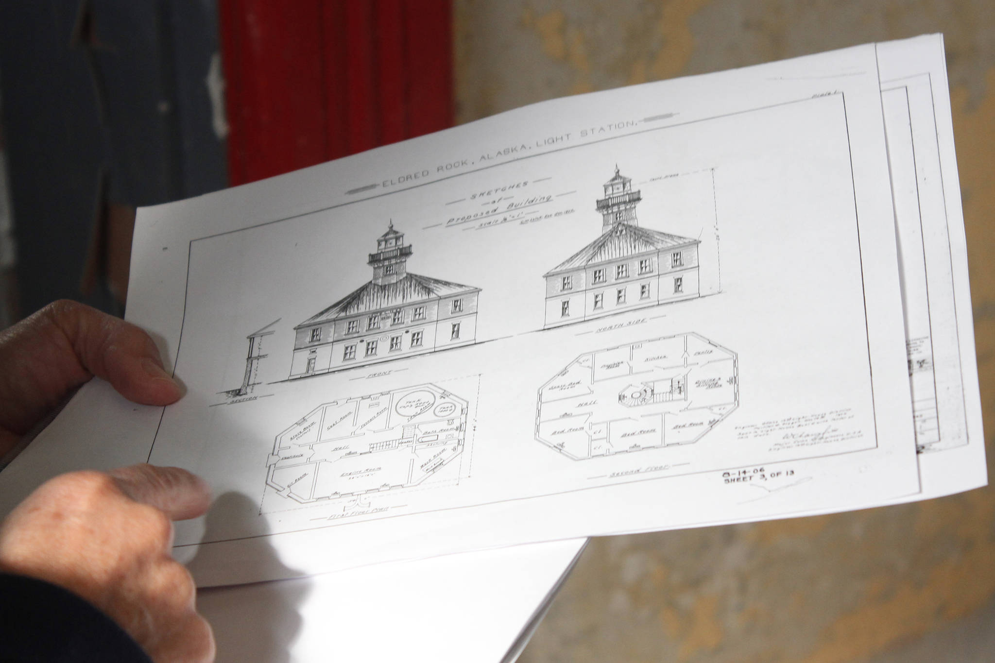 Eldred Rock Lighthouse Preservation Association Executive Director Sue York consults diagrams at Eldred Rock Lighthouse on Monday, April 29, 2019. (Alex McCarthy | Juneau Empire)