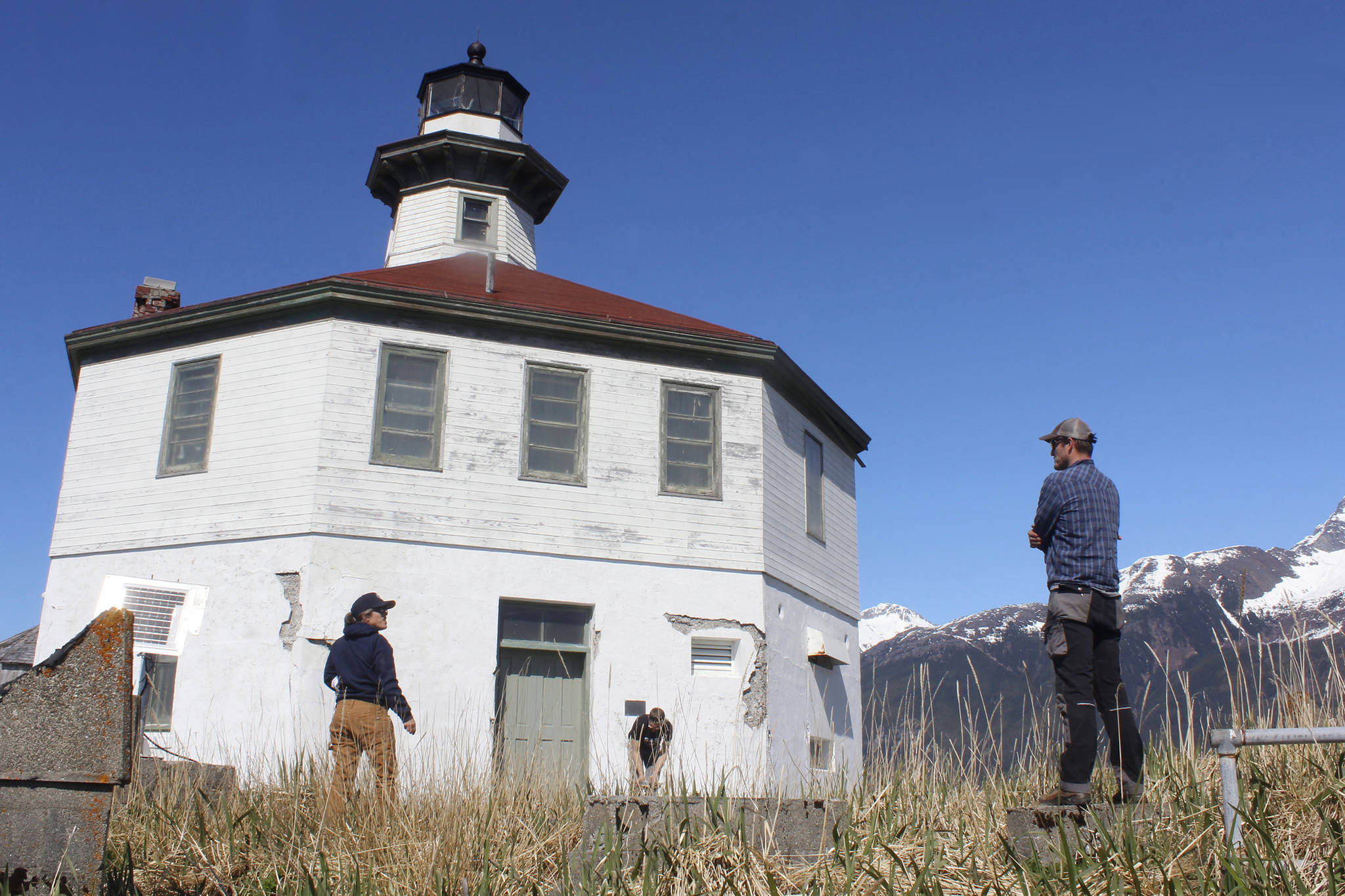 Eldred Rock Lighthouse Preservation Association Executive Director Sue York speaks to Marine Exchange of Alaska Field Operations Supervisor Nick Hatch at Eldred Rock Lighthouse on Monday, April 29, 2019. (Alex McCarthy | Juneau Empire)