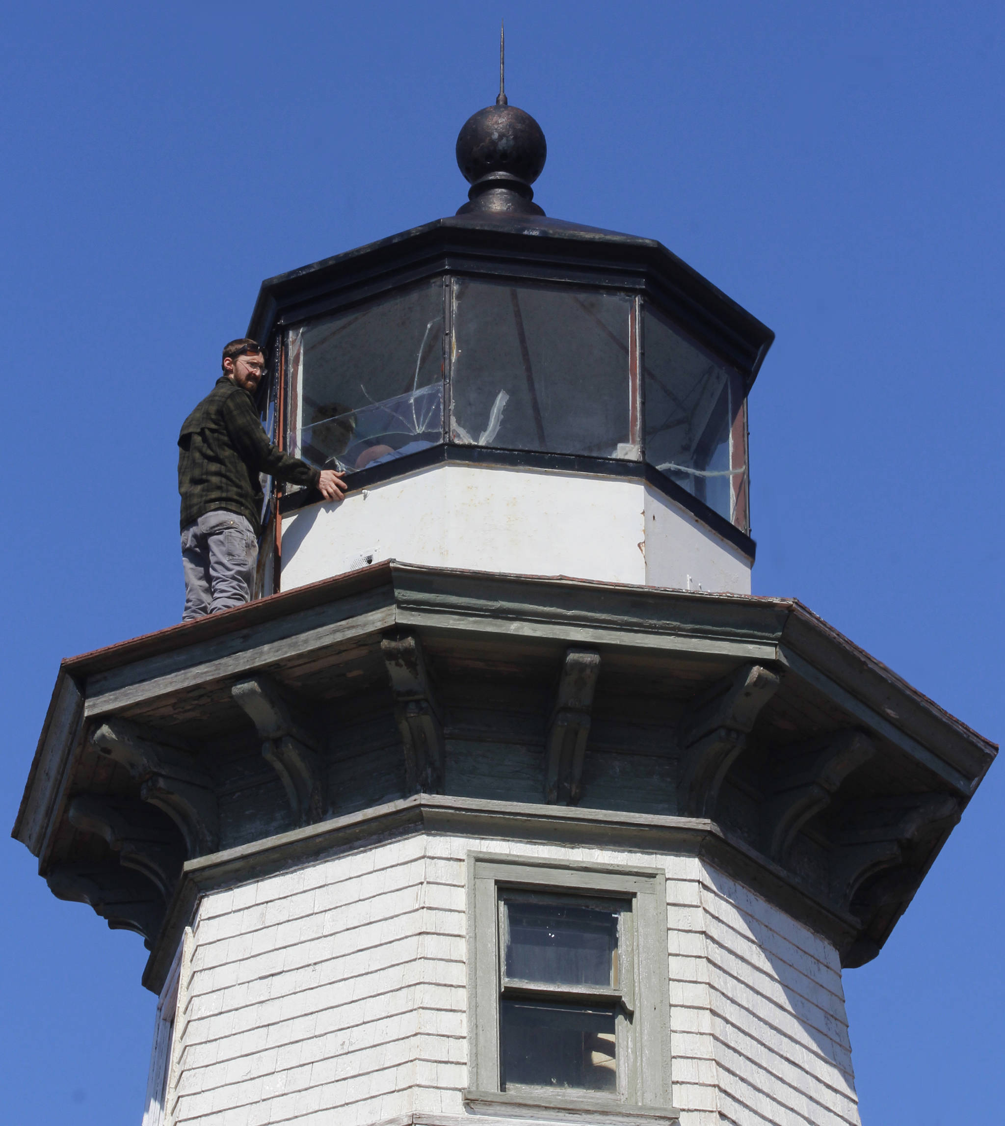 Eldred Rock Lighthouse Preservation Association board member Justin Fantasia takes measurements of the cupola at Eldred Rock Lighthouse on Monday, April 29, 2019. (Alex McCarthy | Juneau Empire)