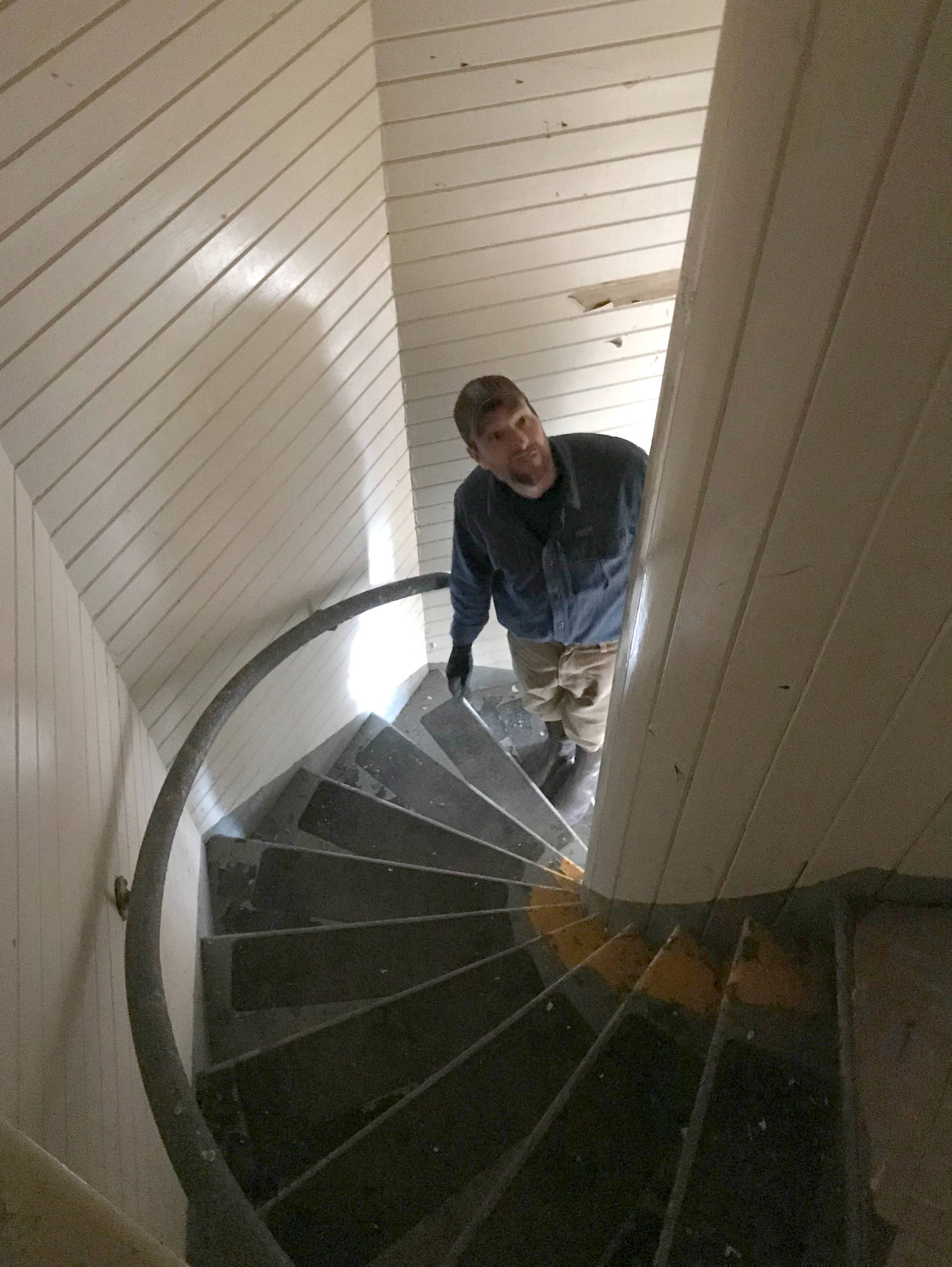 Jonathan Wood, the Marine Exchange of Alaska’s representative on the Eldred Rock Lighthouse Preservation Association, walks up the stairs of Eldred Rock Lighthouse on Monday, April 29, 2019. (Alex McCarthy | Juneau Empire)