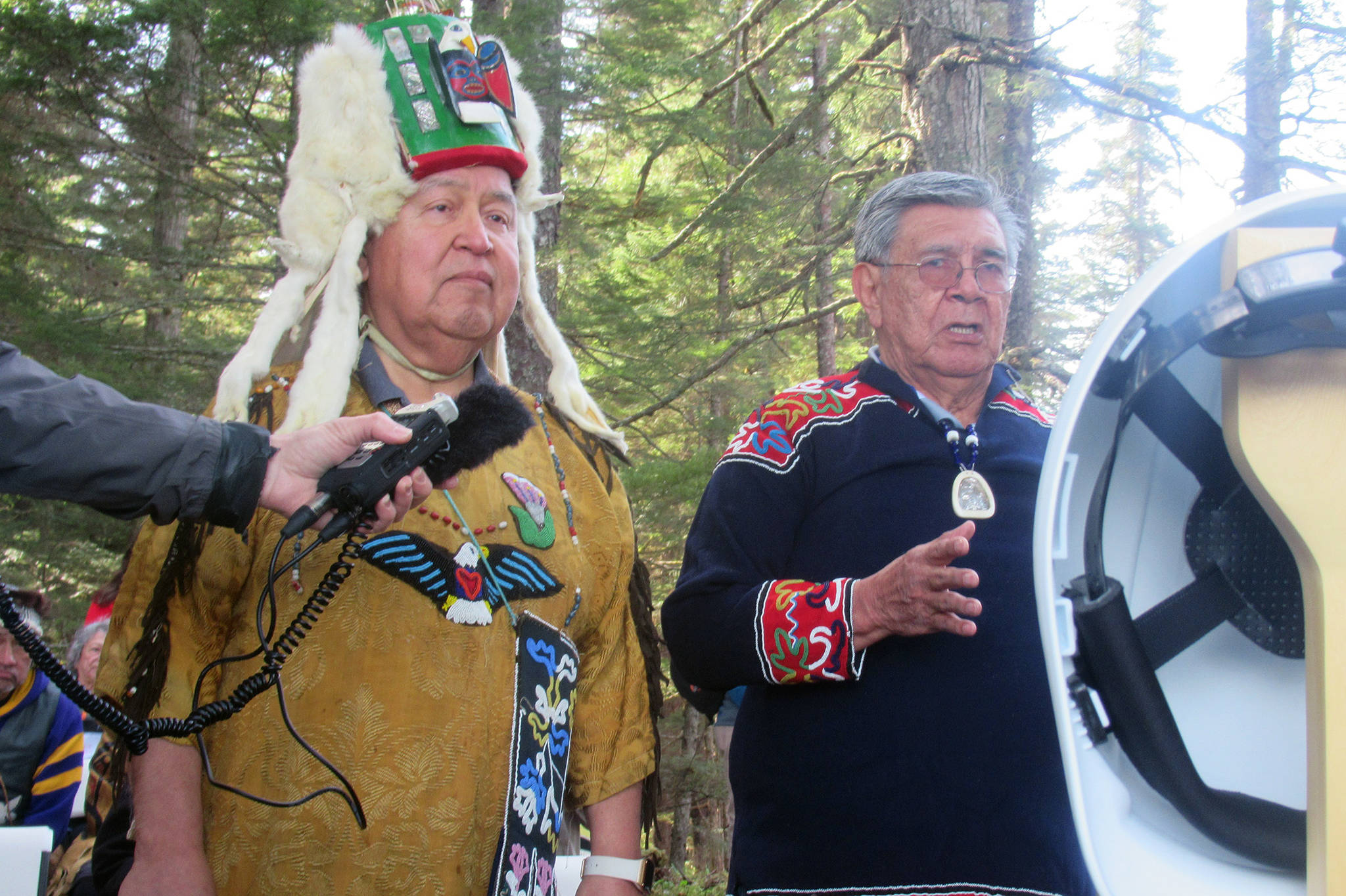 Ozzie Sheakley and Ernest Jack speak during a ground breaking and ground blessing ceremony for at the site of a new dock being built at Icy Strait Point near Hoonah, May 1, 2019. (Ben Hohenstatt | Juneau Empire)