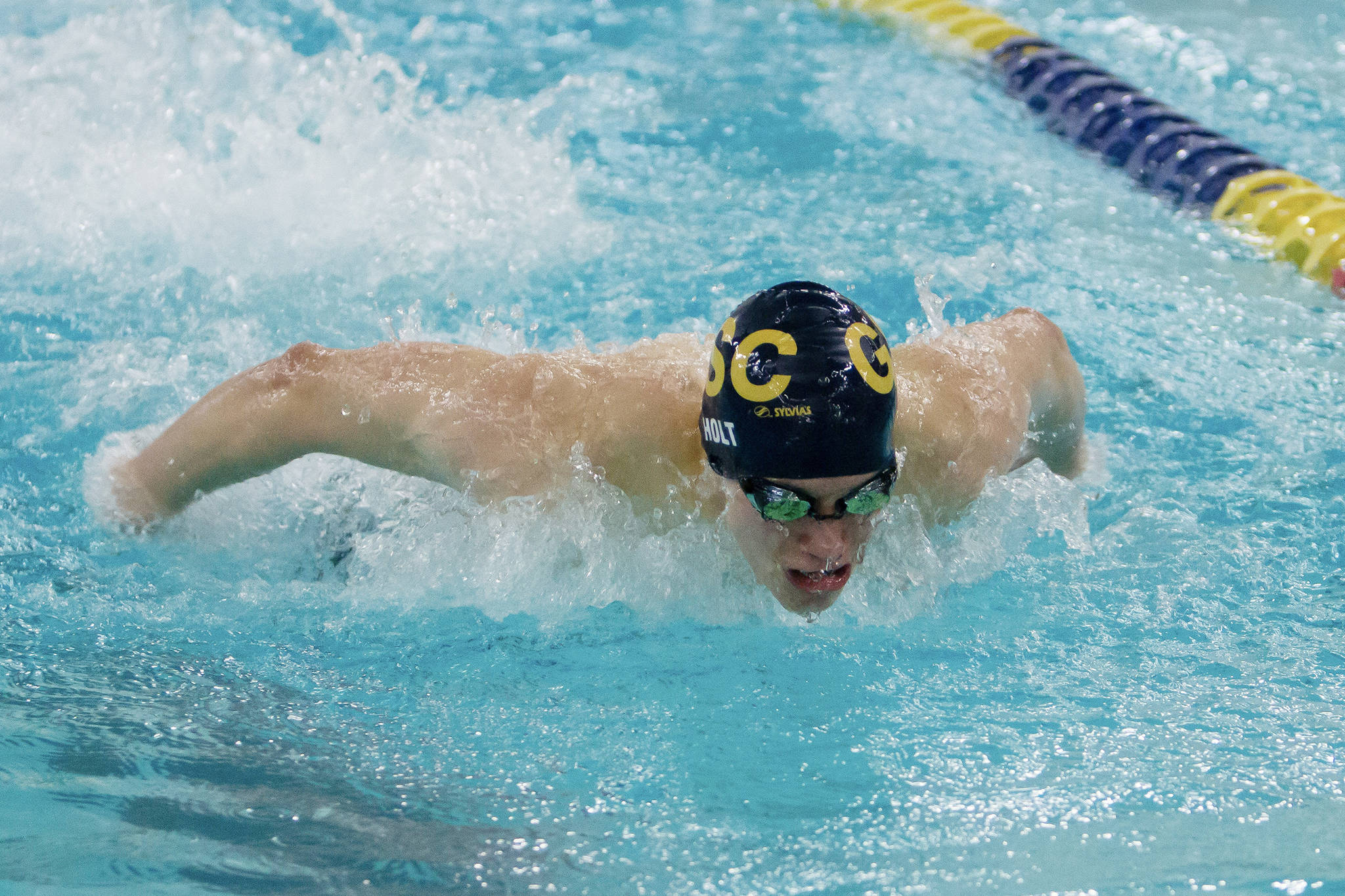 Glacier Swim Clubs Spencer Holt swims in one of his butterfly races at the Alaska Swimming Junior Olympic Championships at Bartlett High School in Anchorage, April 25-28. (Courtesy Photo | Kevin Tuning/Forever Still Photography)
