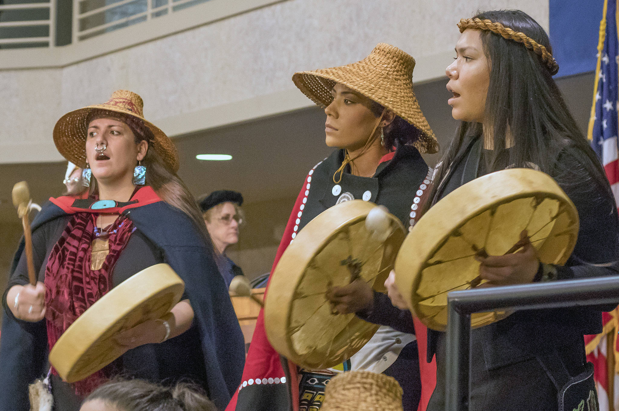 Members of the Mt. Juneau Tlingit and Wossh.ji.een dancers lead the academic procession on stage at the UAS Recreation Center during the UAS commencement ceremony on Sunday, May 5, 2019. (Erin Laughlin | For the Juneau Empire)