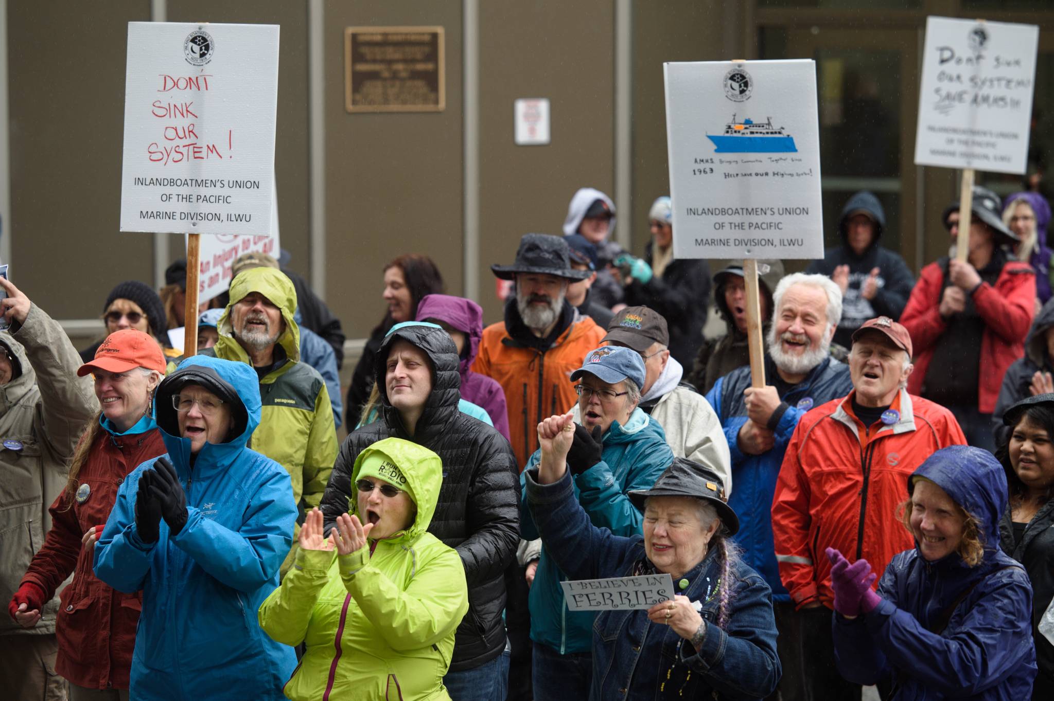 Juneau residents cheer during a SOS Rally at the Capitol on Tuesday, May 7, 2019. (Michael Penn | Juneau Empire)