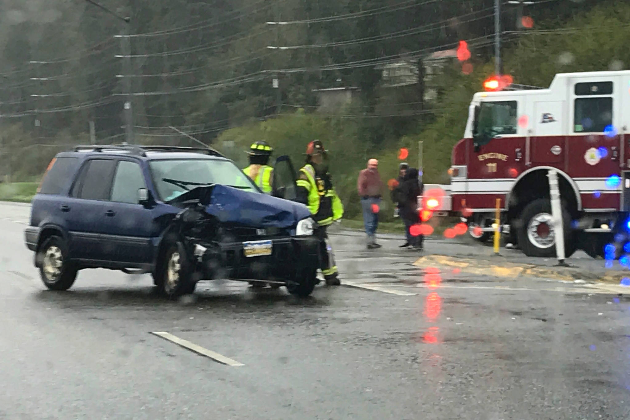 A Honda CRV sits on Egan Drive on Tuesday after a collision with a Ford Focus. No injuries were reported. (Michael Penn | Juneau Empire)