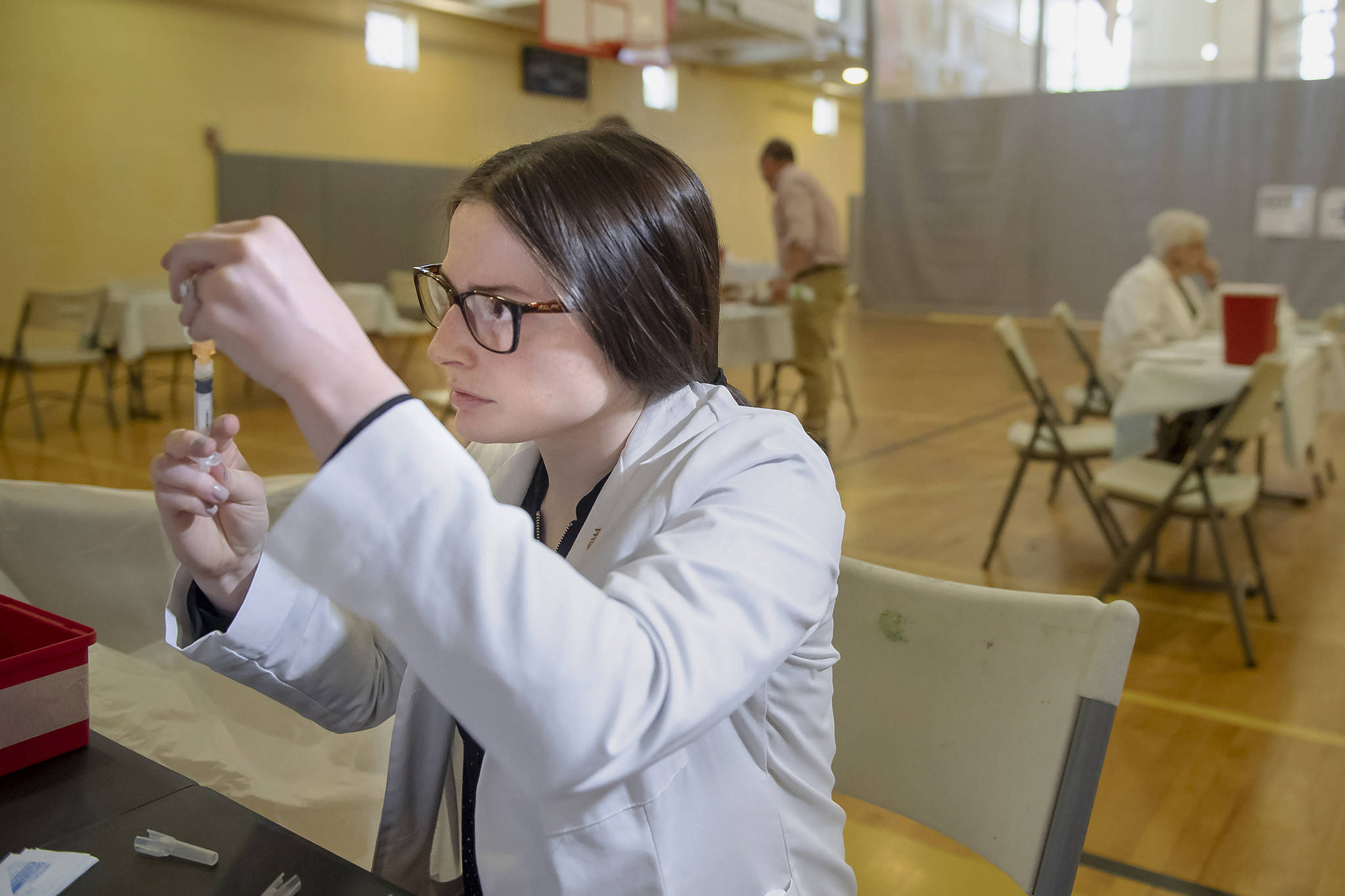 University of Pittsburgh pharmacy student Alexandria Taylor prepares syringes during a free measles vaccination clinic by the Allegheny County Health Department at the Homewood-Brushton YMCA on May 8, 2019 in Pittsburgh. (Steph Chambers | Pittsburgh Post-Gazette)