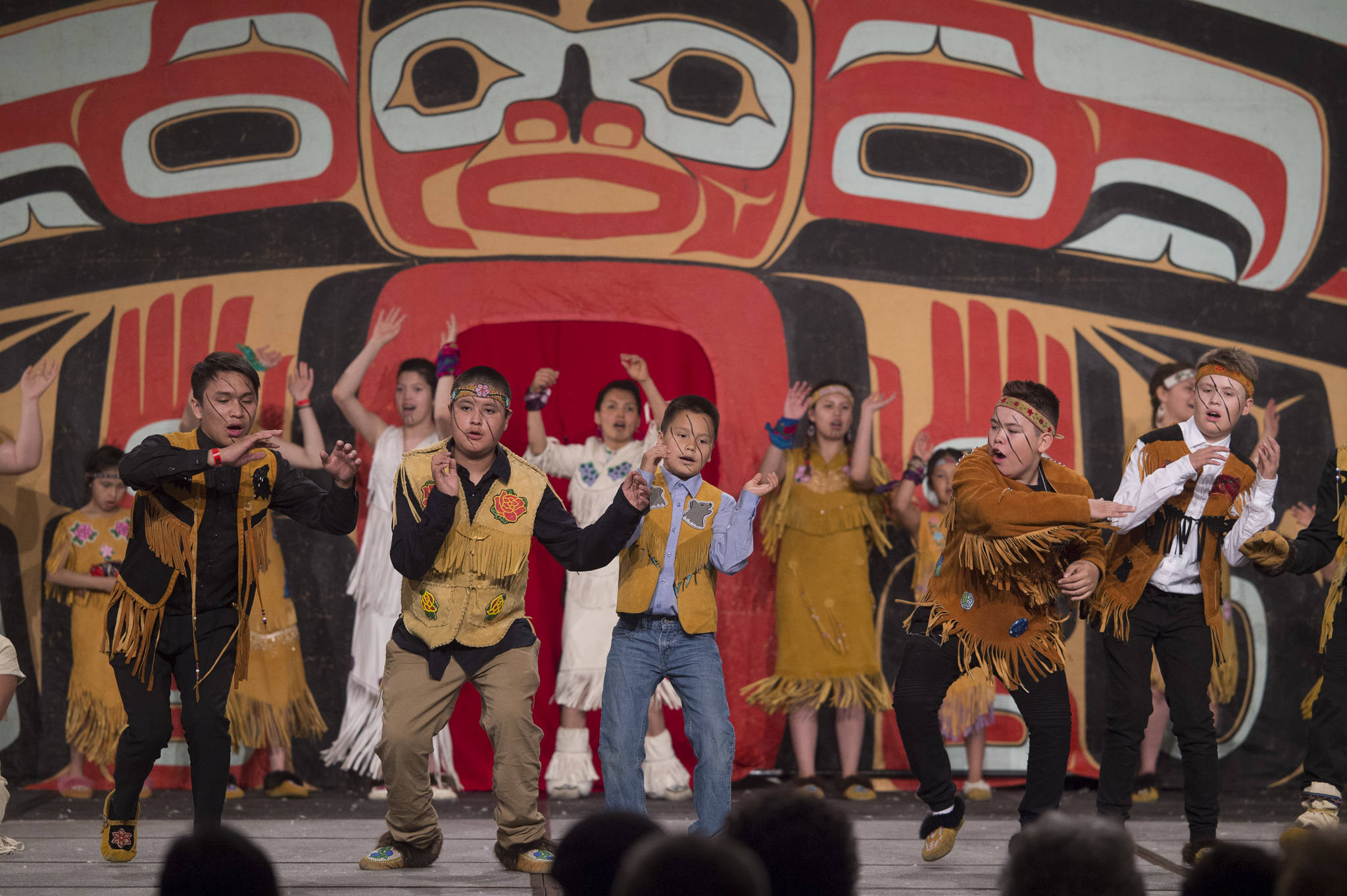 In this June 7, 2018 photo, the Selkirk Spirit Dancers of Pelly Crossing perform on stage for Celebration 2018 at Centennial Hall. (Michael Penn | Juneau Empire File)