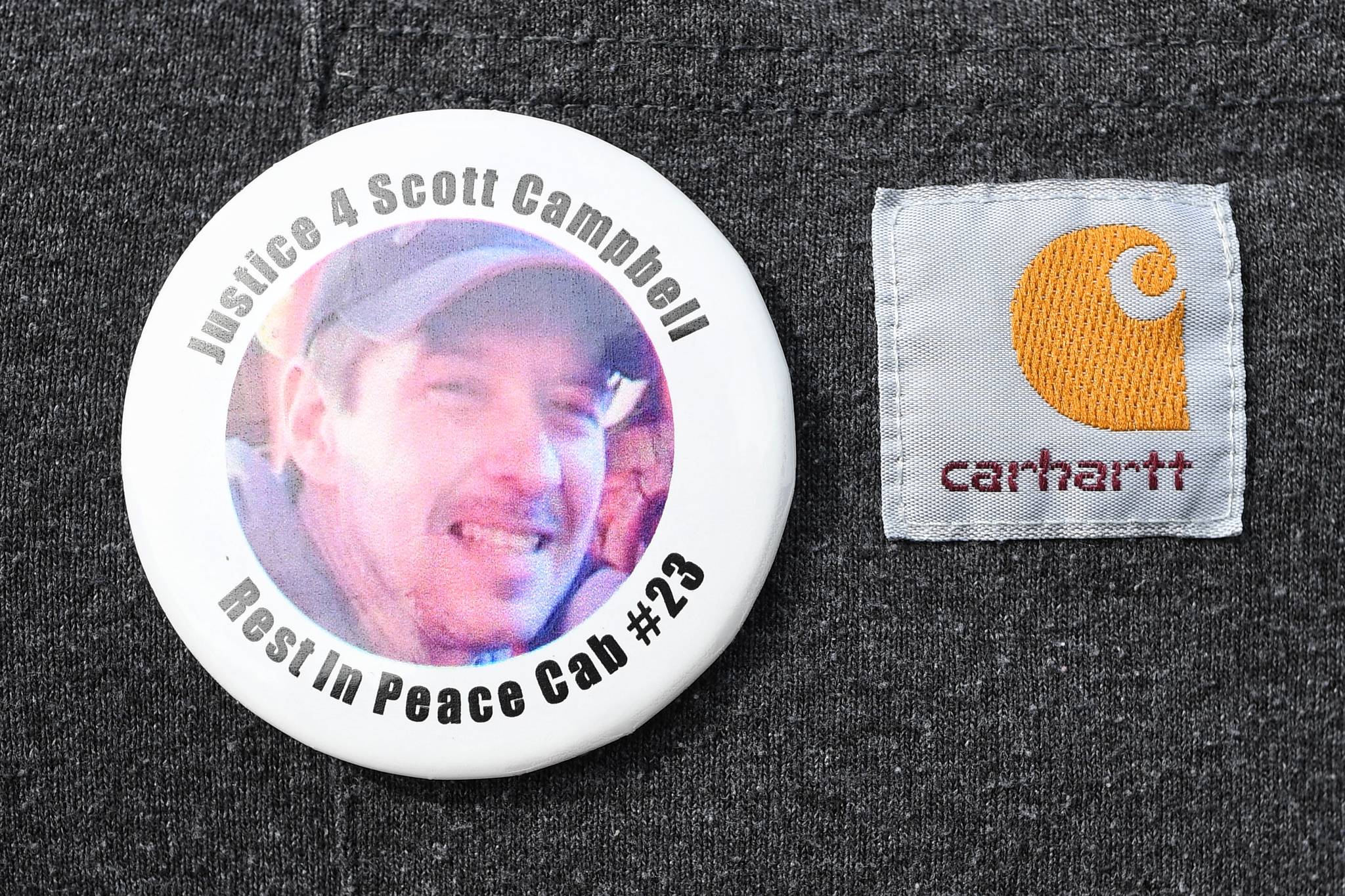 A pin commemorating Scott Campbell is shown on Friday, May 10, 2019. (Michael Penn | Juneau Empire)