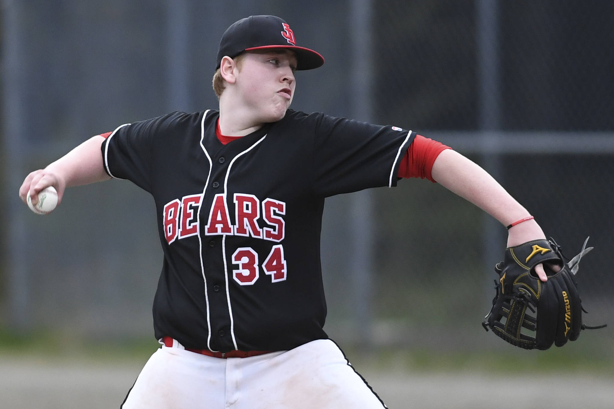 Juneau-Douglas’ Christian Ludeman pitches against Ketchikan in the third inning at Adair-Kennedy Memorial Park on Friday, May 10, 2019. (Michael Penn | Juneau Empire)