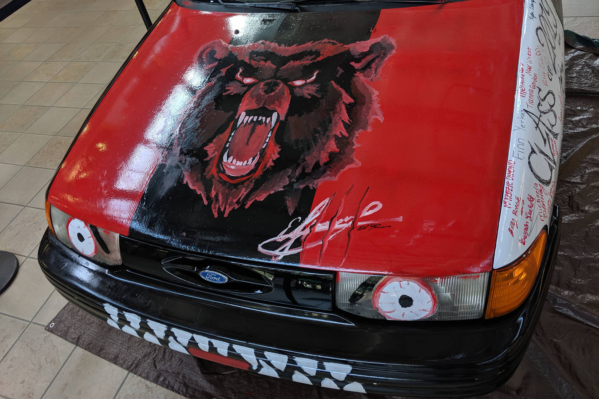 Not a lot of senior pranks include signatures, but the car assembled in the Juneau-Douglas High School: Yadaa.at Kalé commons sometime before Monday, May 13, 2019, includes the signed names of many seniors. (Ben Hohenstatt | Juneau Empire)