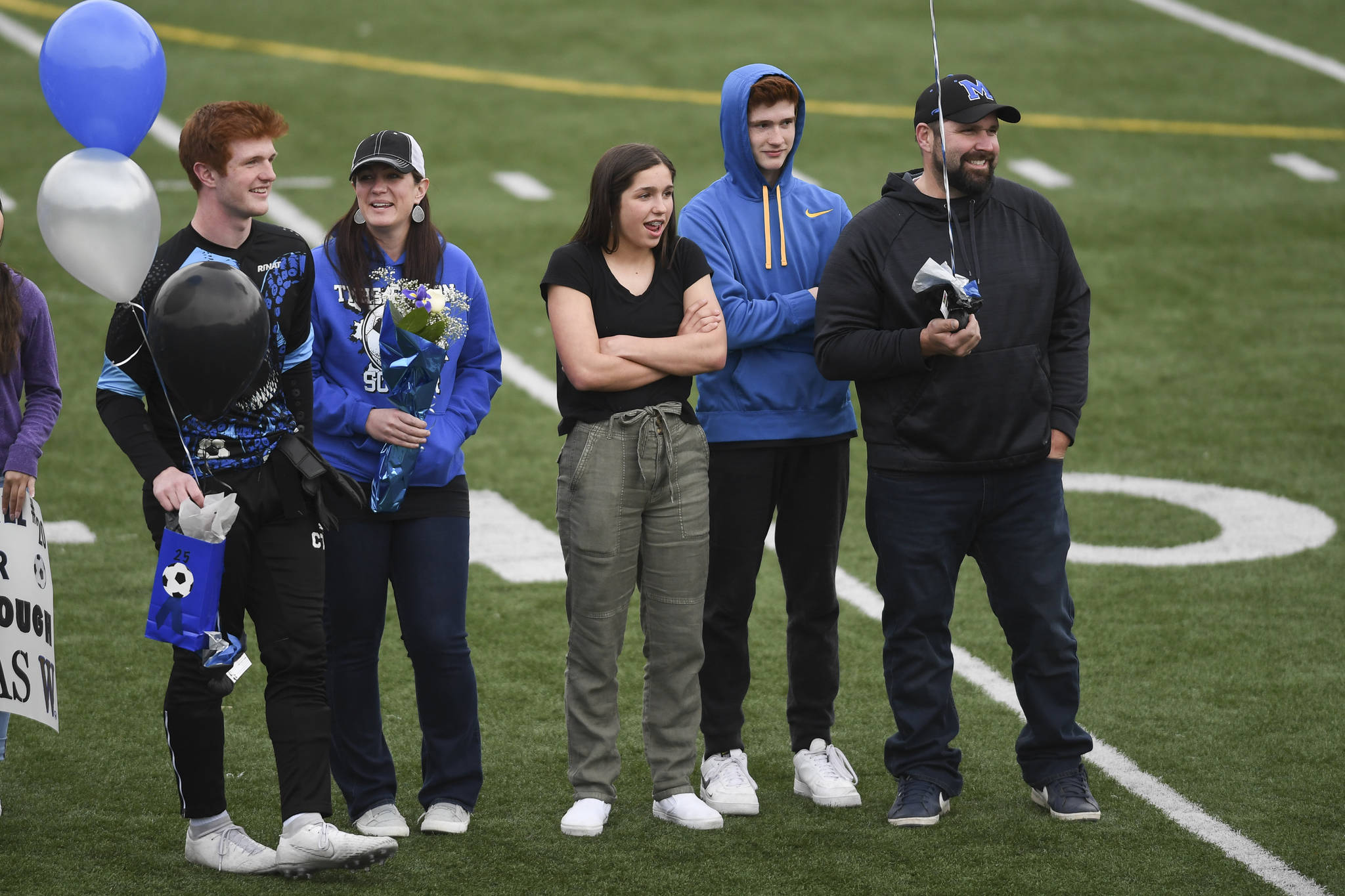 Thunder Mountains Caleb Traxler celebrates Senior Night with his family at TMHS on Tuesday, May 14, 2019. (Michael Penn | Juneau Empire)