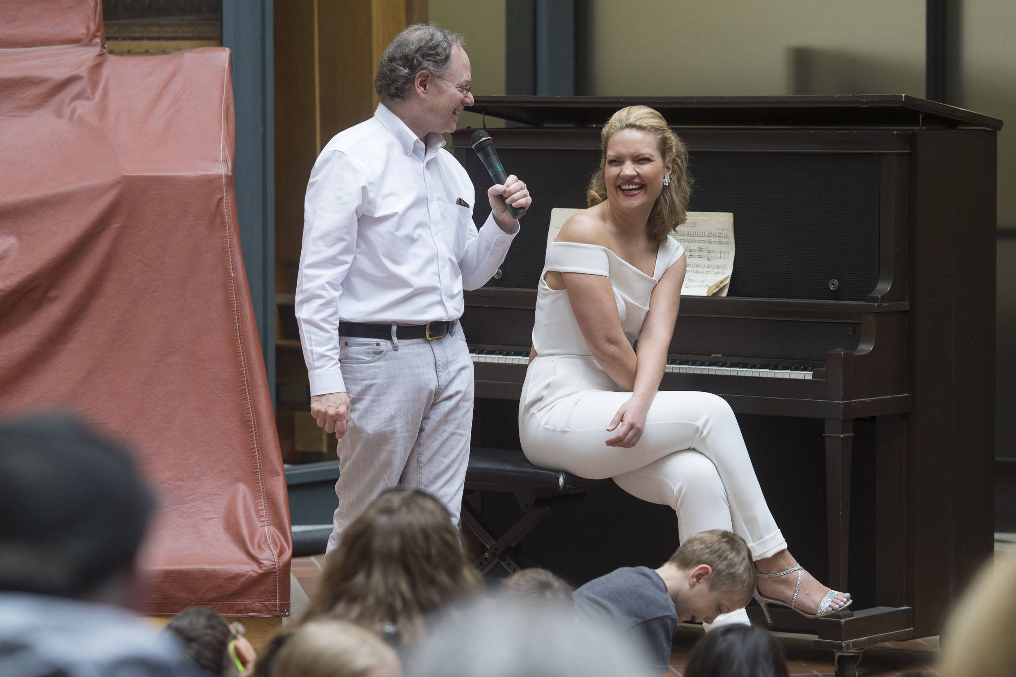 Julie Coucheron and William Ransom talk about the four-handed pieces for piano they perform during a Juneau Jazz & Classic’s Brown Bag Concert at the State Office Building on Tuesday, May 7, 2019. (Michael Penn | Juneau Empire)