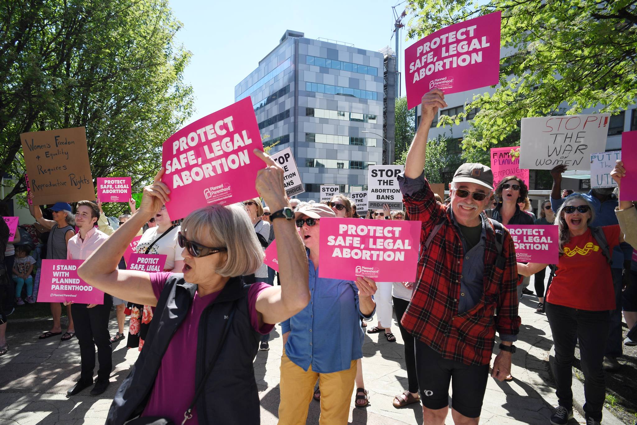People attend a rally against anti-abortion laws at the Dimond Courthouse Plaza on Tuesday, May 21, 2019. (Michael Penn | Juneau Empire)