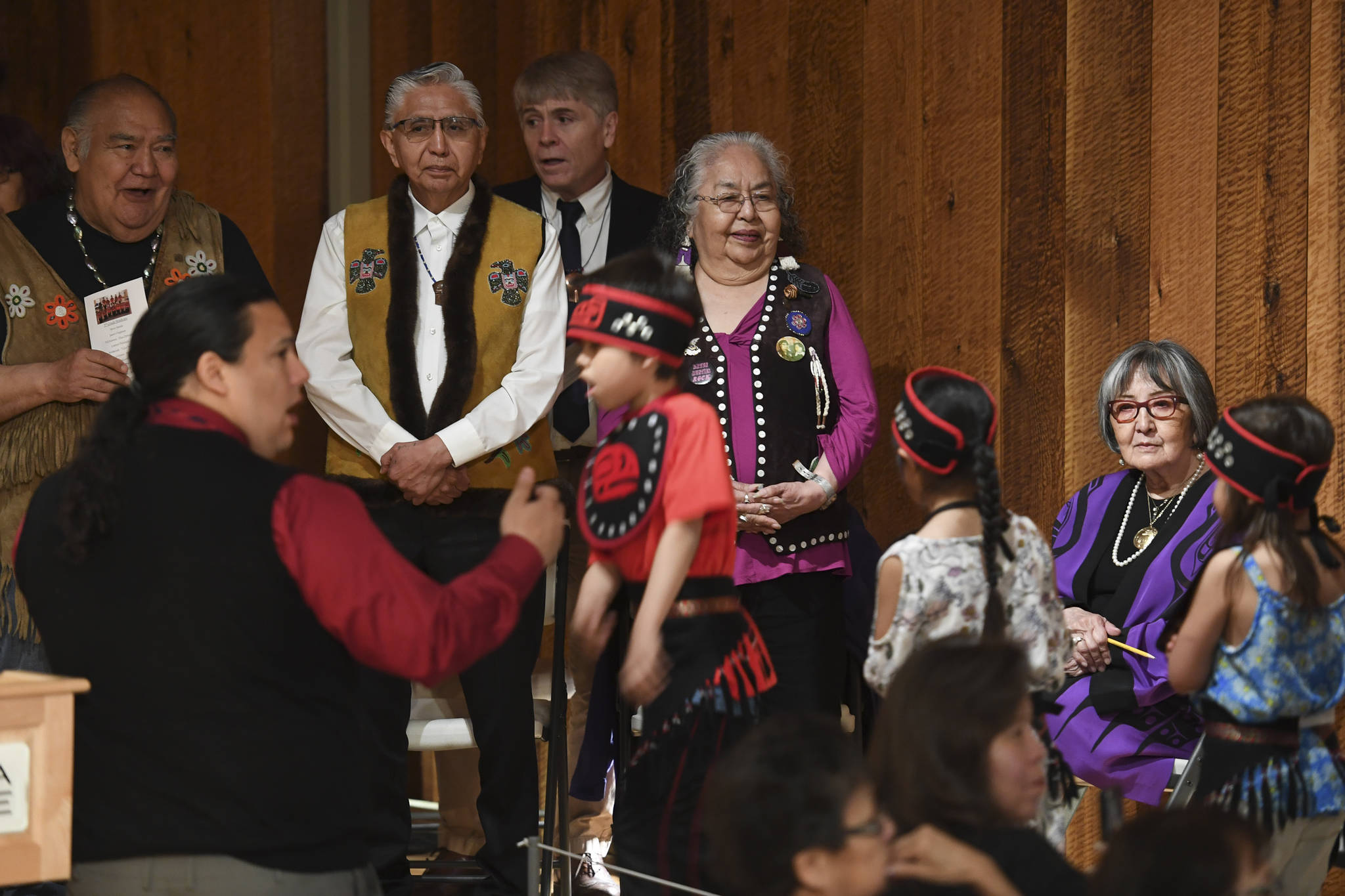 Elders watch as students in the Tlingit Culture Language & Literacy 5th Grade Promotion held in the clan house at the Walter Soboleff Center on Wednesday, May 22, 2019. (Michael Penn | Juneau Empire)