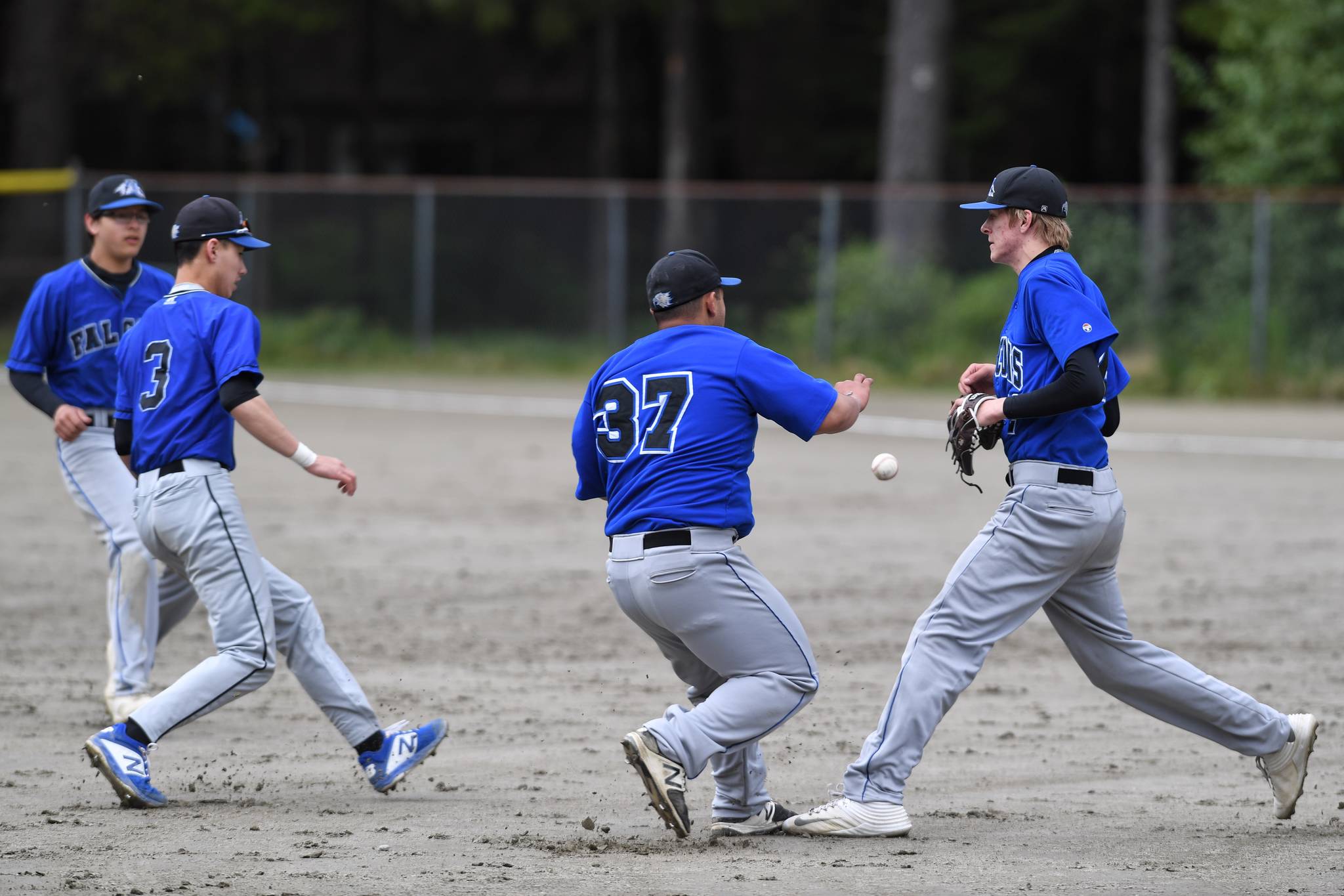 A pop-up drops between Thunder Mountain infielders during the Region V Baseball Championship at Adair-Kennedy Memorial Park on Friday, May 24, 2019. (Michael Penn | Juneau Empire)