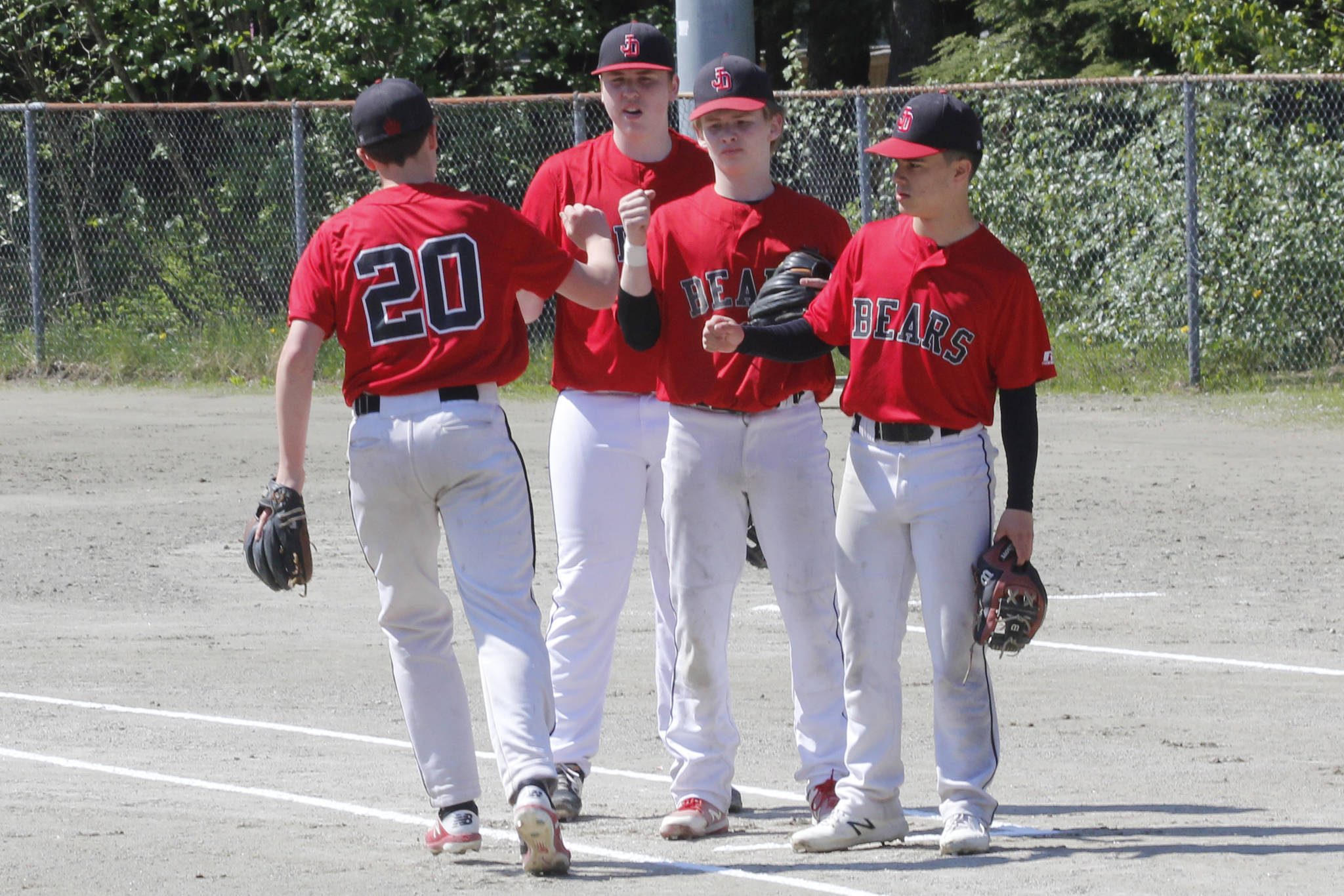 Juneau-Douglas High School: Yadaa.at Kale players warm up before the Region V title game against Ketchikan on Saturday, May 25, 2019. (Alex McCarthy | Juneau Empire)