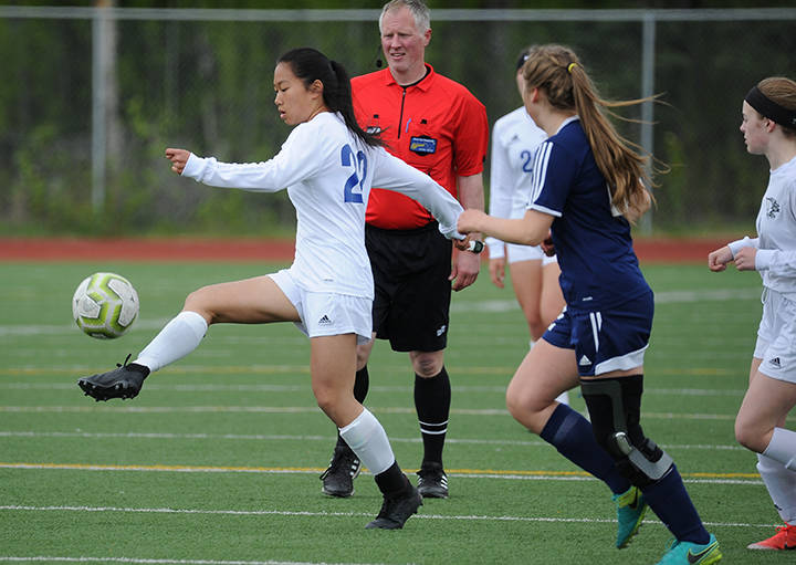Thunder Mountain’s Molly Brocious moves the ball past a crowd during the ASAA/First National Bank Alaska soccer state championships at Eagle River High School on Thursday, May 23, 2019. TMHS won 1-0. (Michael Dinneen | For the Juneau Empire)
