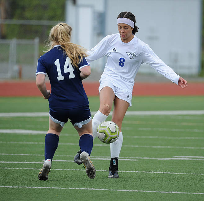 Thunder Mountain’s Keana Villanueva gets the ball past Homer’s Daisy Kettle during the ASAA/First National Bank Alaska soccer state championships at Eagle River High School on Thursday, May 23, 2019. TMHS won 1-0. (Michael Dinneen | For the Juneau Empire)