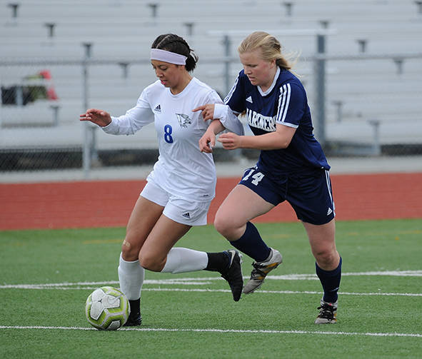Thunder Mountain’s Keana Villanueva dribbles past Homer’s Daisy Kettle during the ASAA/First National Bank Alaska soccer state championships at Eagle River High School on Thursday, May 23, 2019. TMHS won 1-0. (Michael Dinneen | For the Juneau Empire)