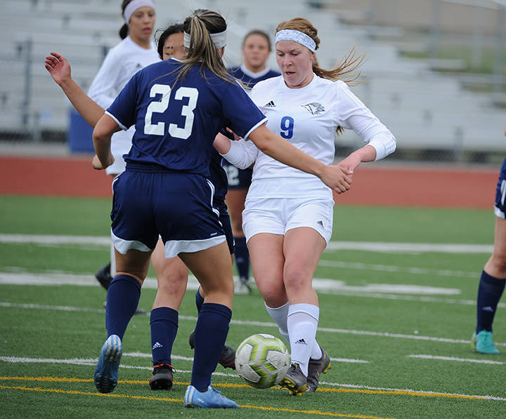 Thunder Mountain’s Sally Thompson encounters Homer’s Kimberly Lynn during the ASAA/First National Bank Alaska soccer state championships at Eagle River High School on Thursday, May 23, 2019. TMHS won 1-0. (Michael Dinneen | For the Juneau Empire)