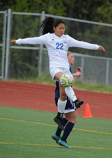 Thunder Mountain’s Molly Brocious elevates over a Homer defender during the ASAA/First National Bank Alaska soccer state championships at Eagle River High School on Thursday, May 23, 2019. TMHS won 1-0. (Michael Dinneen | For the Juneau Empire)