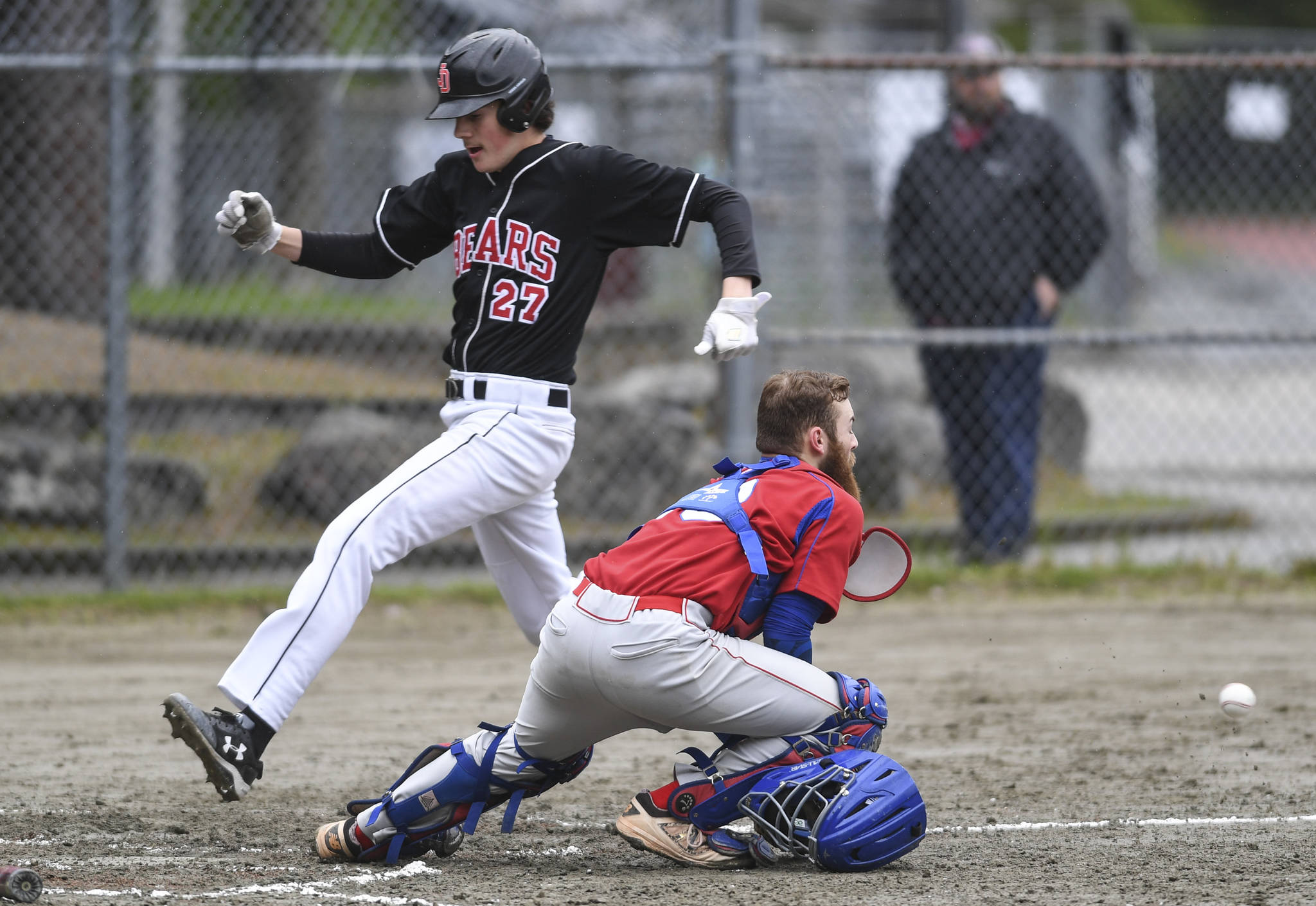 Juneau-Douglas’ scores in front of the throw to Sitka’s catcher Morgan Simic in the fourth inning during the Region V Baseball Championship at Adair-Kennedy Memorial Park on Thursday, May 23, 2019. JDHS won 6-5. (Michael Penn | Juneau Empire)