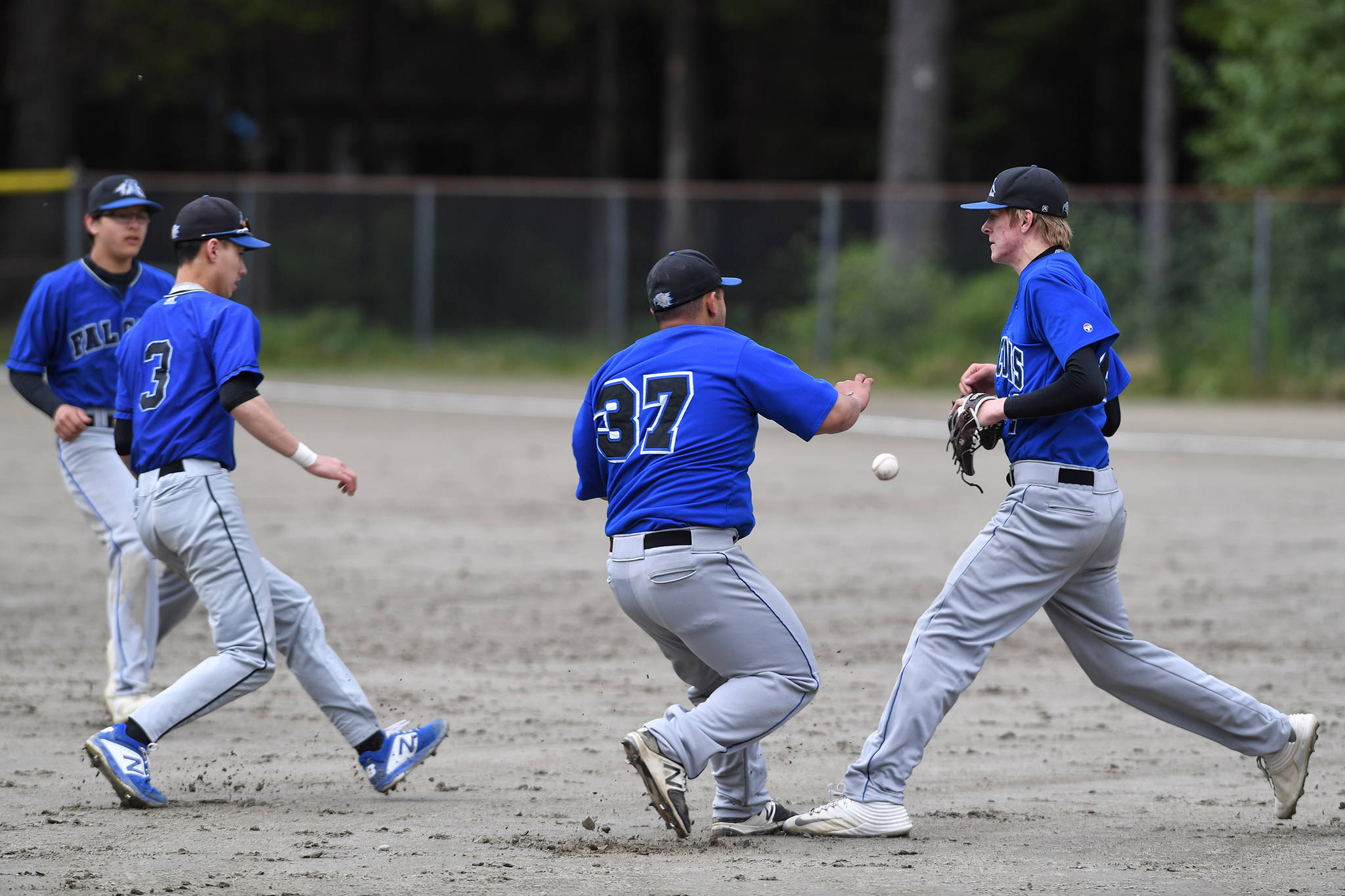 A pop-up drops between Thunder Mountain infielders as they play Sitka during the Region V Baseball Championship at Adair-Kennedy Memorial Park on Friday, May 24, 2019. TMHS lost 1-7. (Michael Penn | Juneau Empire)