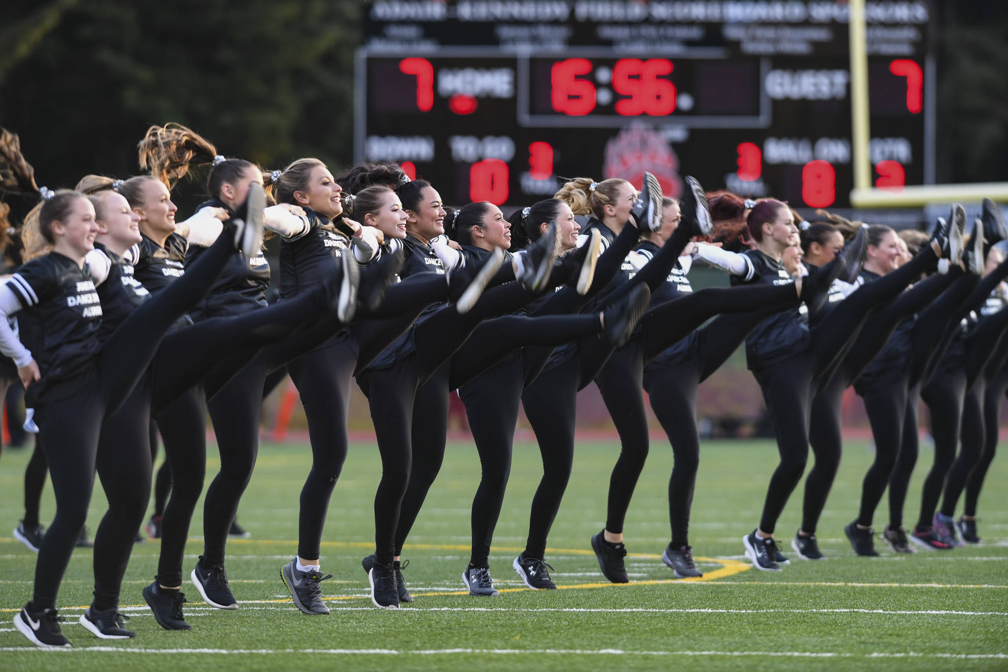 Members of the Juneau Alumni Dance Team perform during halftime of the 1st annual Juneau Alumni Football Game with football players, dance team members and cheerleaders from Juneau-Douglas and Thunder Mountain High Schools at Adair-Kennedy Memorial Field on Friday, May 24, 2019. (Michael Penn | Juneau Empire)