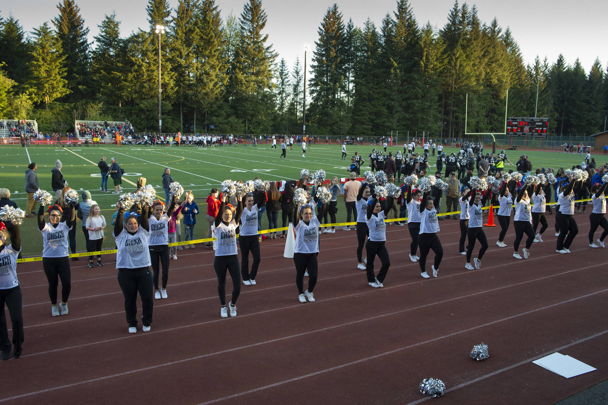Scenes from the Juneau Alumni Football Game with football players, dance team members and cheerleaders from Juneau-Douglas and Thunder Mountain High Schools at Adair-Kennedy Memorial Field on Friday, May 24, 2019. (Michael Penn | Juneau Empire)