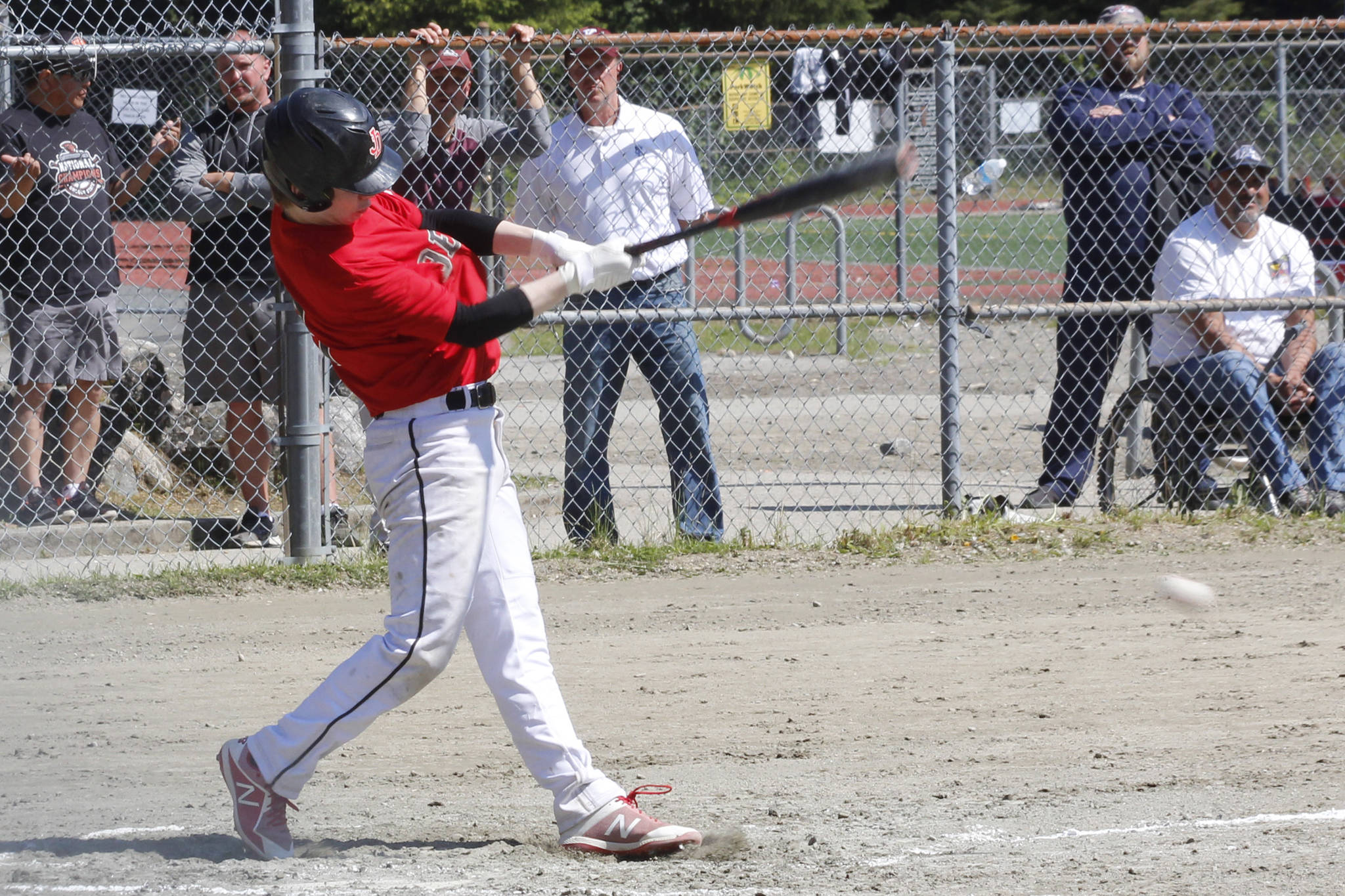 Juneau-Douglas High School: Yadaa.at Kale infielder Austin McCurley hits a ground ball in the Region V title game against Ketchikan on Saturday, May 25, 2019. (Alex McCarthy | Juneau Empire)
