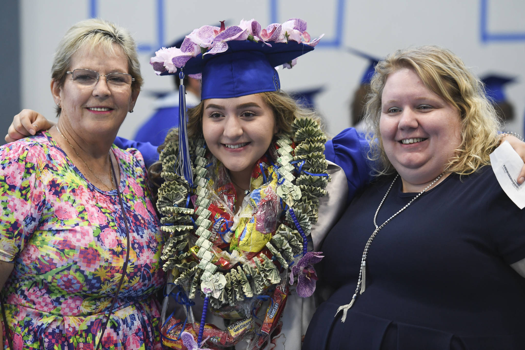 Karina Ireno poses for a picture with her mother, Holly, right, and grandmother, Christina Tisdale before the Thunder Mountain High School graduation on Sunday, May 26, 2019. (Michael Penn | Juneau Empire)
