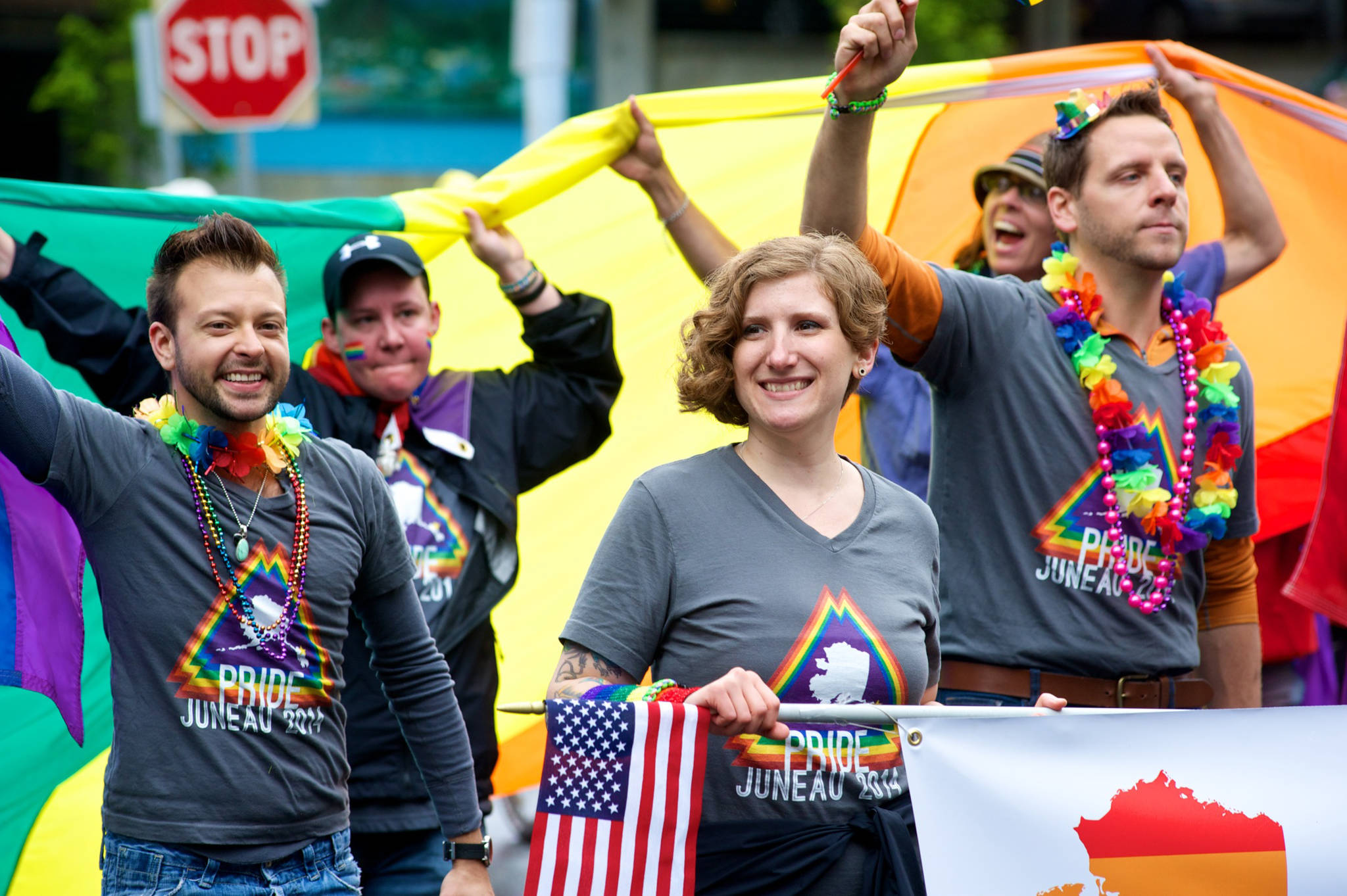 Members of the LGBT community show their pride in the 2014 Juneau Fourth of July Parade. (Michael Penn | Juneau Empire File)