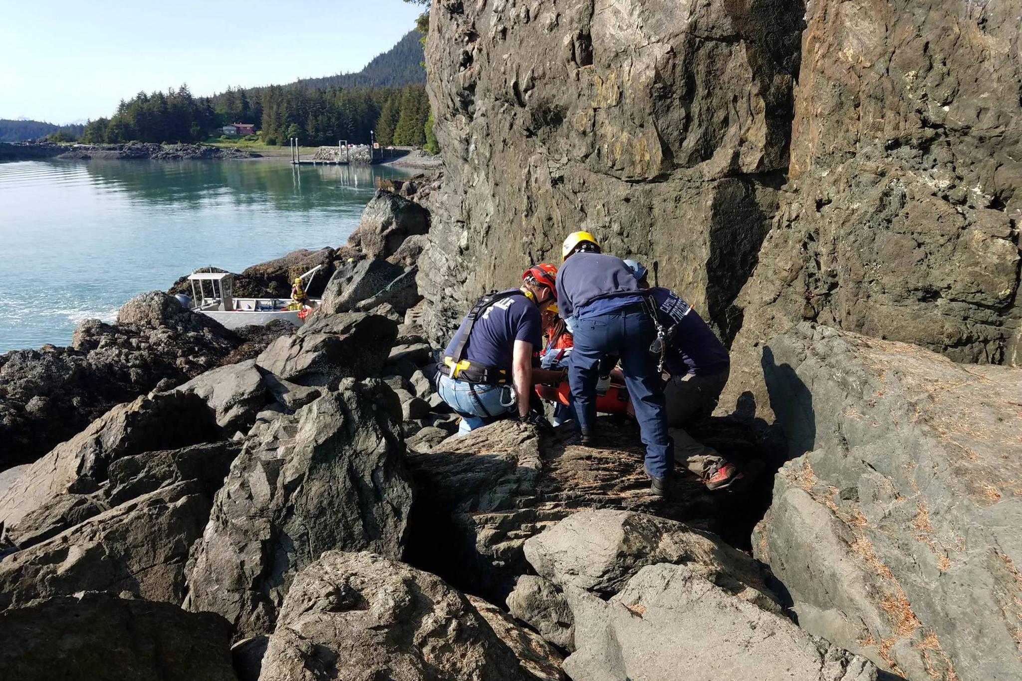 Capital City Fire/Rescue personnel prepare to load Juneau man Chuck Sidlinger into a rescue boat after he fell from a trail on Wednesday, May 29, 2019. (Courtesy photo | Meredith Trainor)