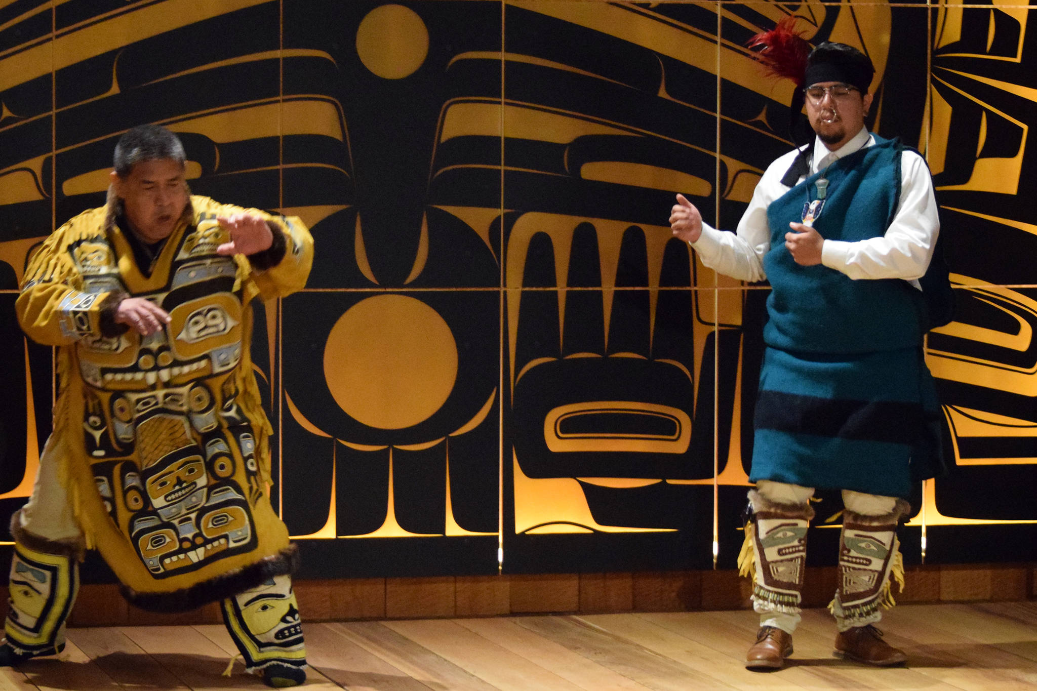 Dean George and Elijah Marks dance while wearing Chilkat Leggings, Friday, May 31, 2019. One pair of leggings was made by weavers Anastasia Shaawaat Ku Gei Hobson-George and Lily Hope and the other pair was made by Hope’s late mother, Clarissa Rizal, and Rizal’s mentor Jennie Thlunaut. (Ben Hohenstatt | Juneau Empire)