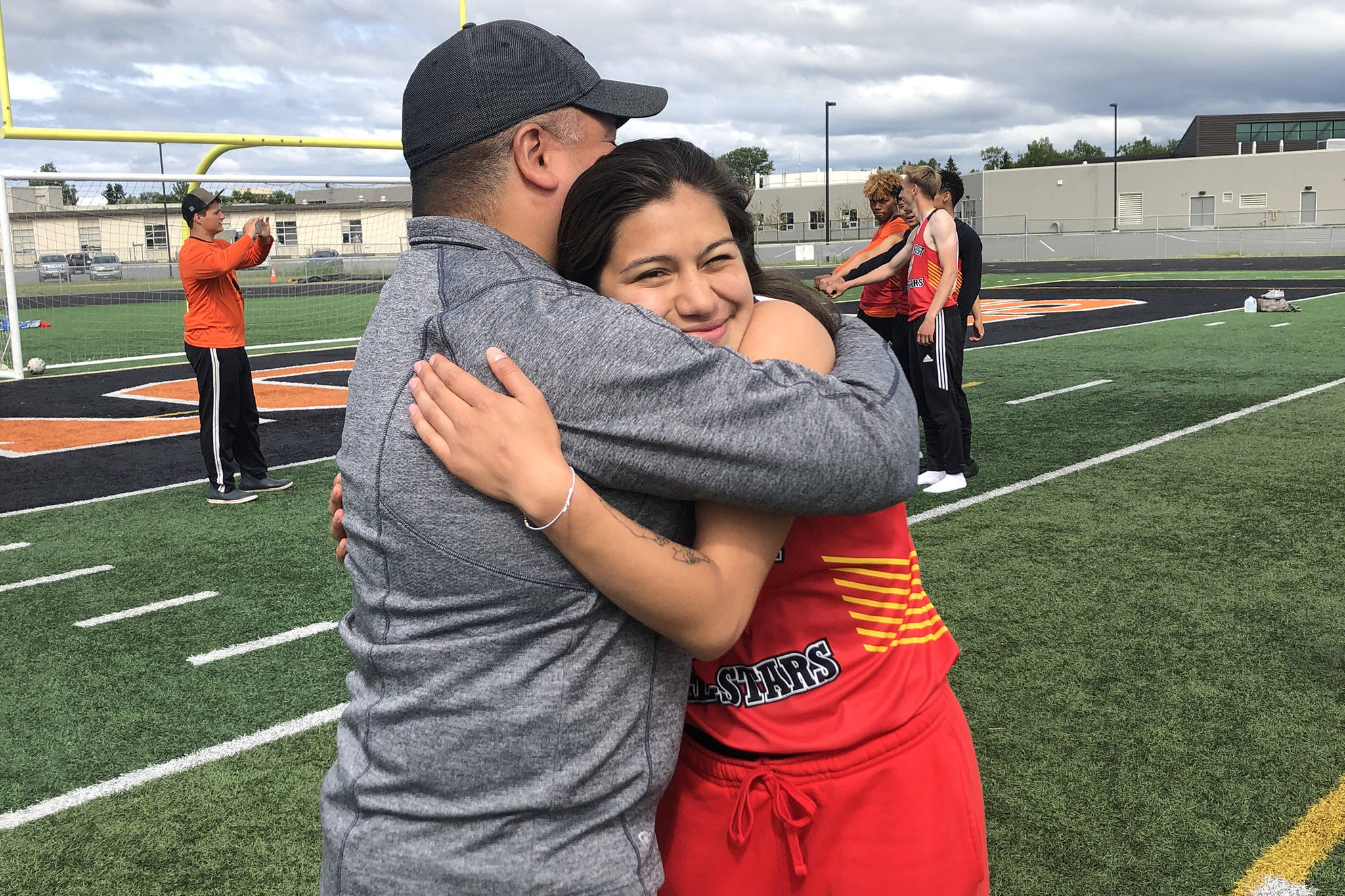 North/Southeast All-Stars coach Louis Tagaban hugs his daughter Bailey Wery Tagaban at the Brian Young Invitational at West Anchorage High School on Saturday, June 1, 2019. (Courtesy Photo | Louis Tagaban)